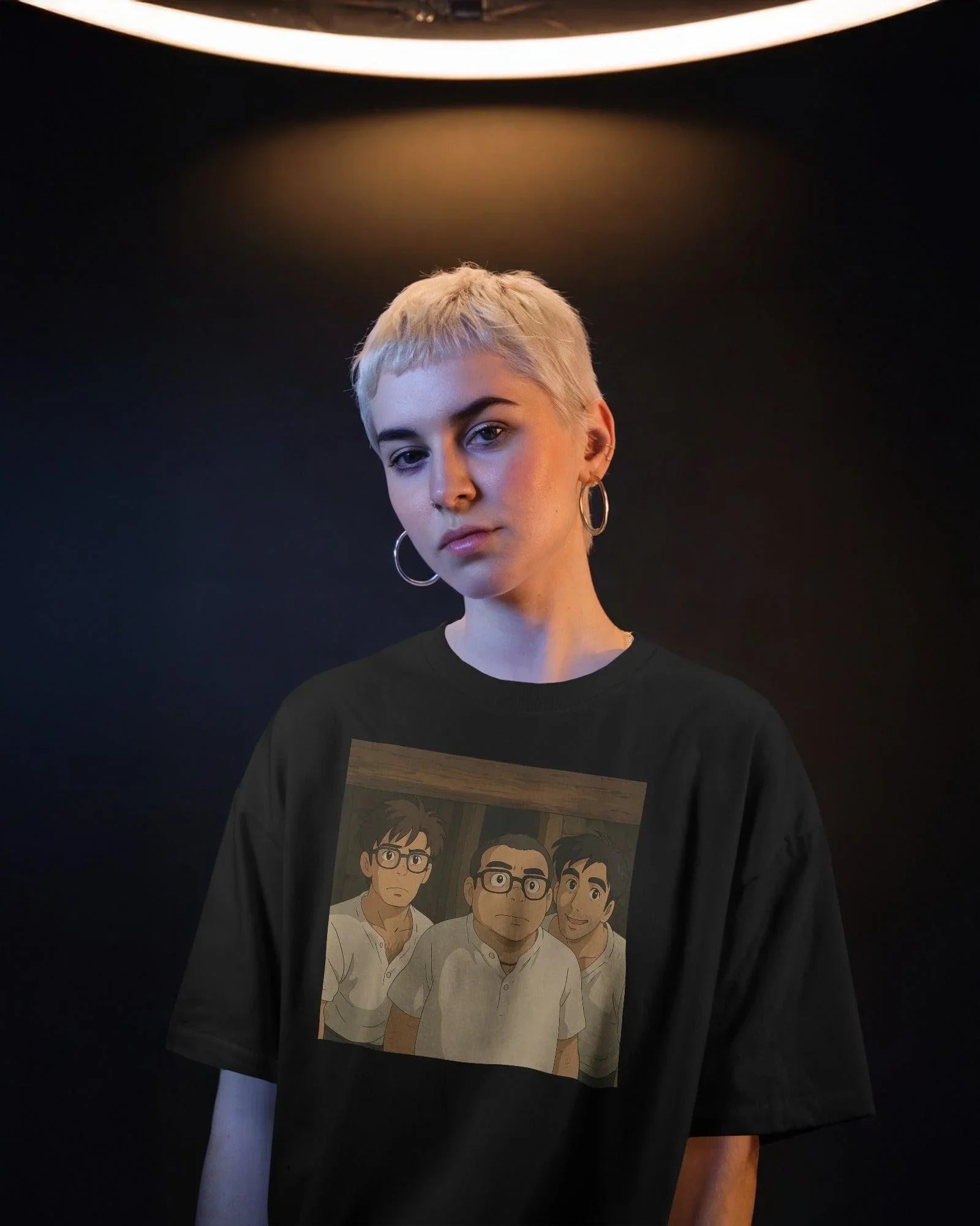 Black oversized t-shirt featuring a unique fusion of Ghibli art and Hera Pheri's iconic Babu Rao. The design blends anime-style illustration with the beloved Bollywood character, printed on premium cotton for a soft and durable finish.
