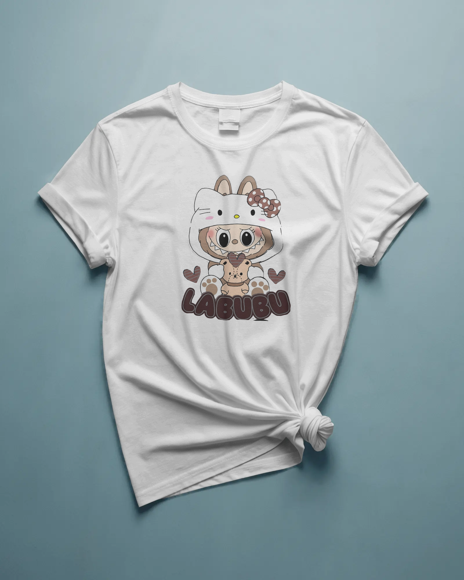 White t-shirt with a cartoon character and 'LABUBU' text on a light blue background.