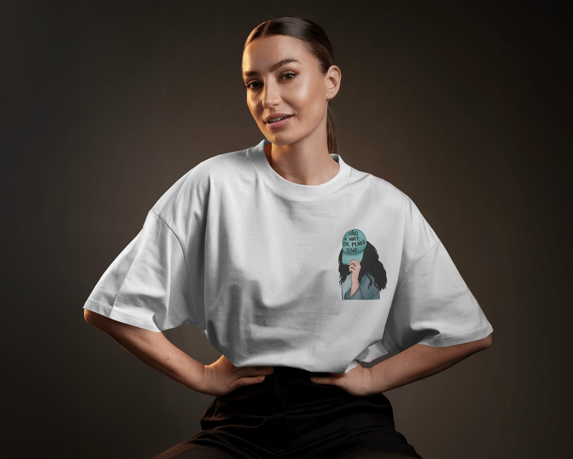 White women's t-shirt from Nitorious Atelier featuring the bold quote 'Find a Way or Make It' in a stylish font. Made from premium cotton for a soft and comfortable fit.