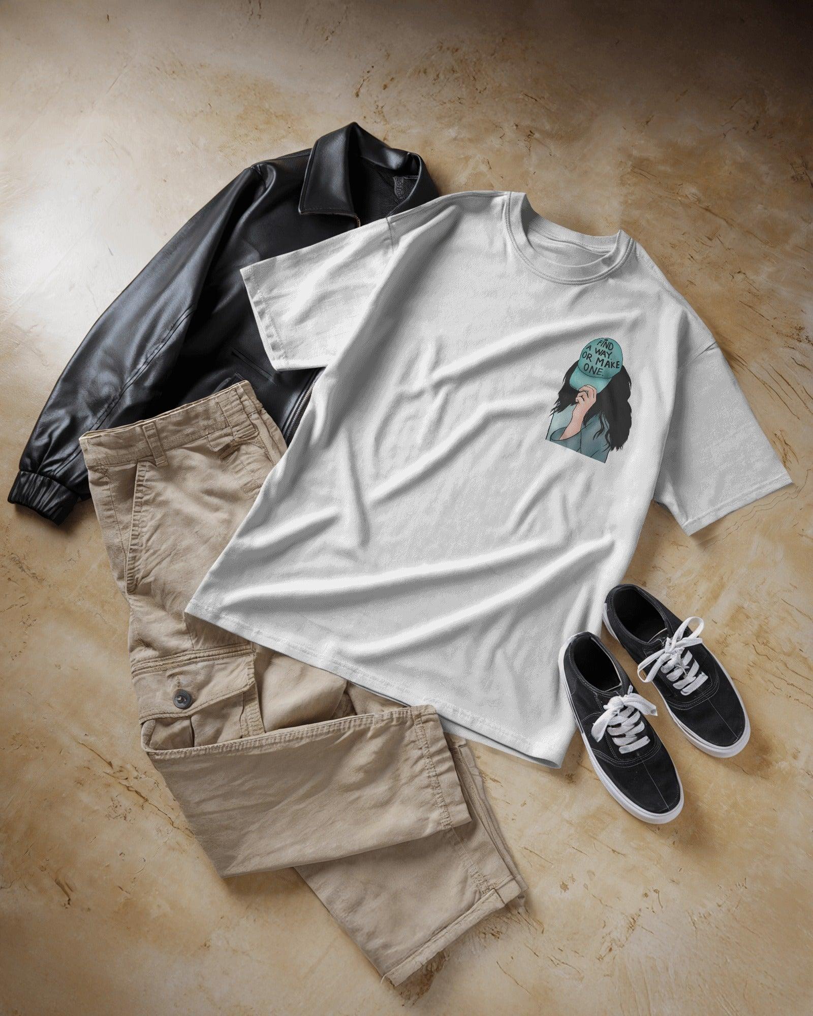 White women's t-shirt from Nitorious Atelier featuring the bold quote 'Find a Way or Make It' in a stylish font. Made from premium cotton for a soft and comfortable fit.