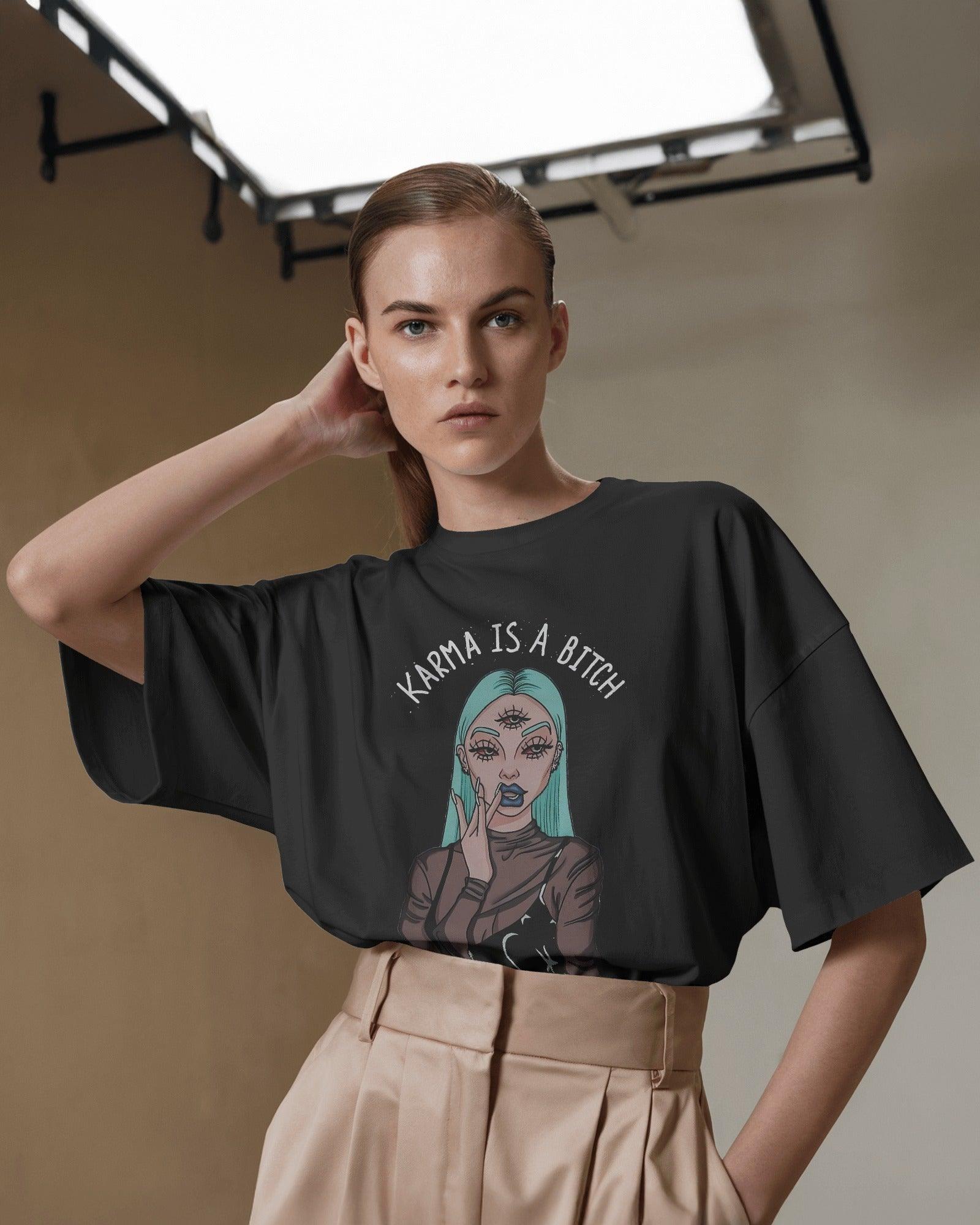 Oversized black t-shirt for women featuring the bold statement "Karma is a Bitch" in a striking font. Made from premium cotton, this t-shirt offers a relaxed fit for ultimate comfort. Its edgy design makes a powerful style statement, perfect for casual and streetwear looks.