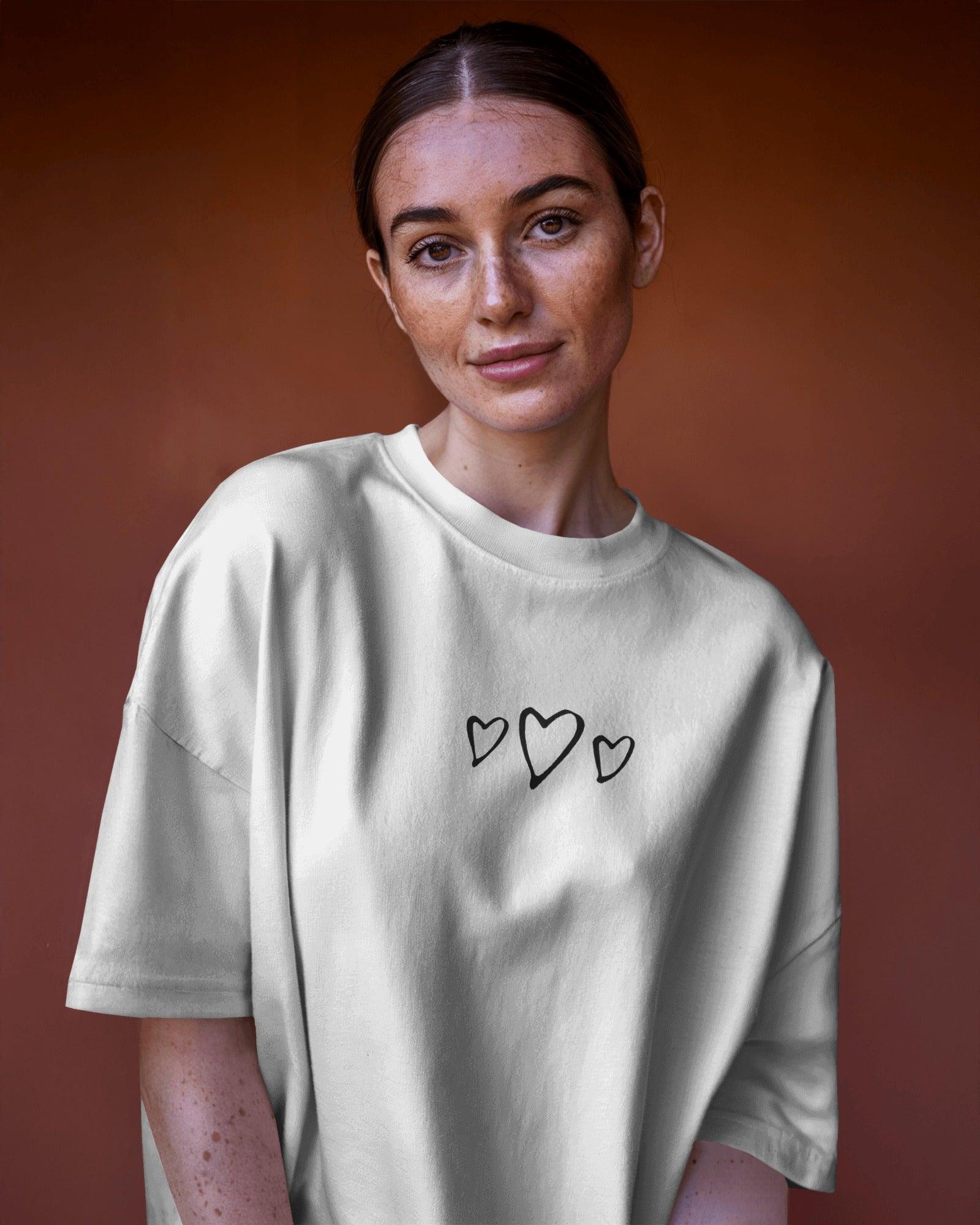 Oversized white t-shirt for women featuring the bold text "Moody But Make It Funky" in a stylish, playful font. Made from premium cotton, this t-shirt offers a relaxed fit for all-day comfort. Perfect for casual wear, the design adds a fun and expressive touch to any outfit.