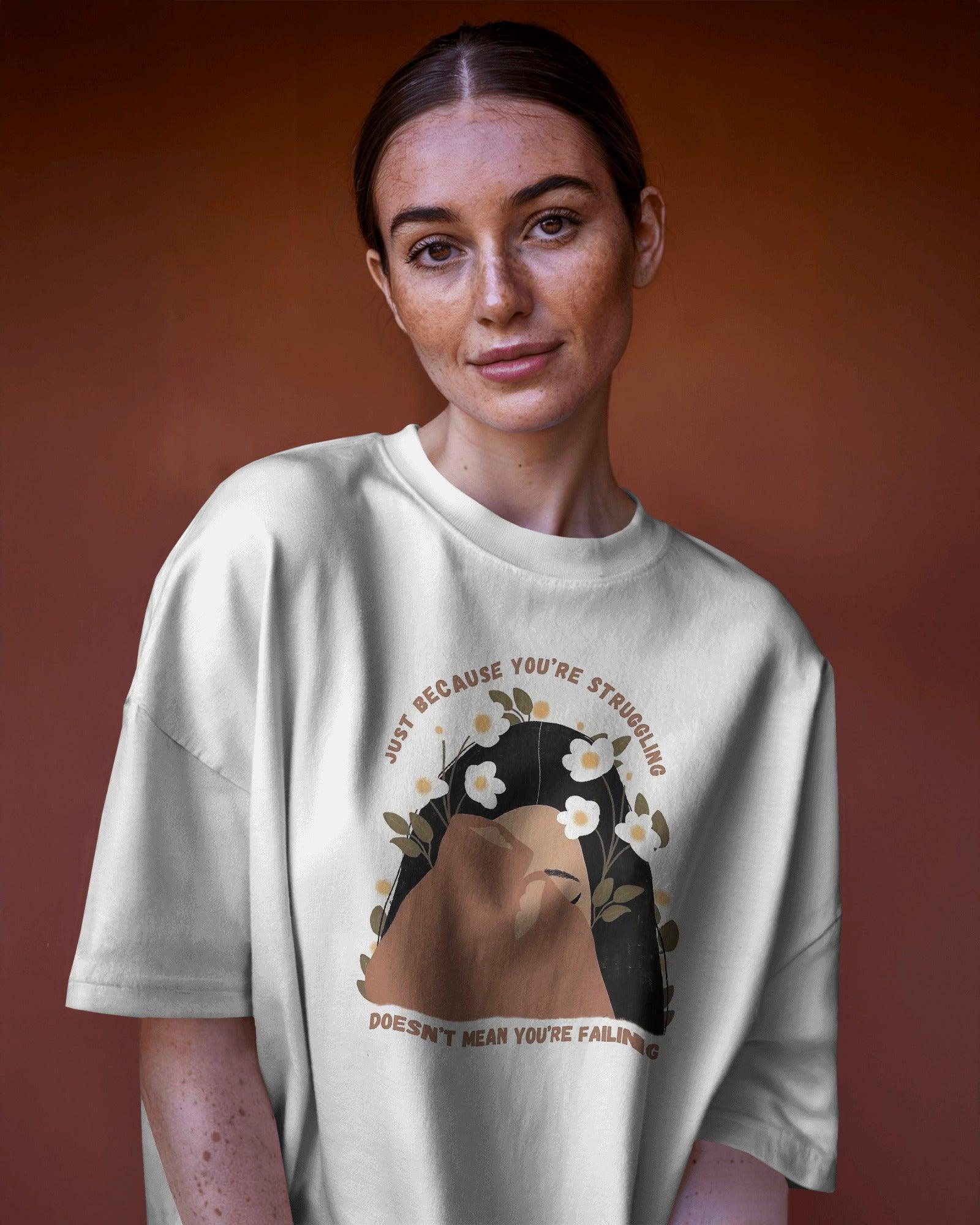 White oversized Tiara t-shirt for women from Nitorious Atelier. Made from premium cotton, this stylish and comfortable t-shirt features a minimal yet elegant tiara design, perfect for a casual yet chic look. Breathable fabric ensures all-day comfort, making it a must-have wardrobe essential.