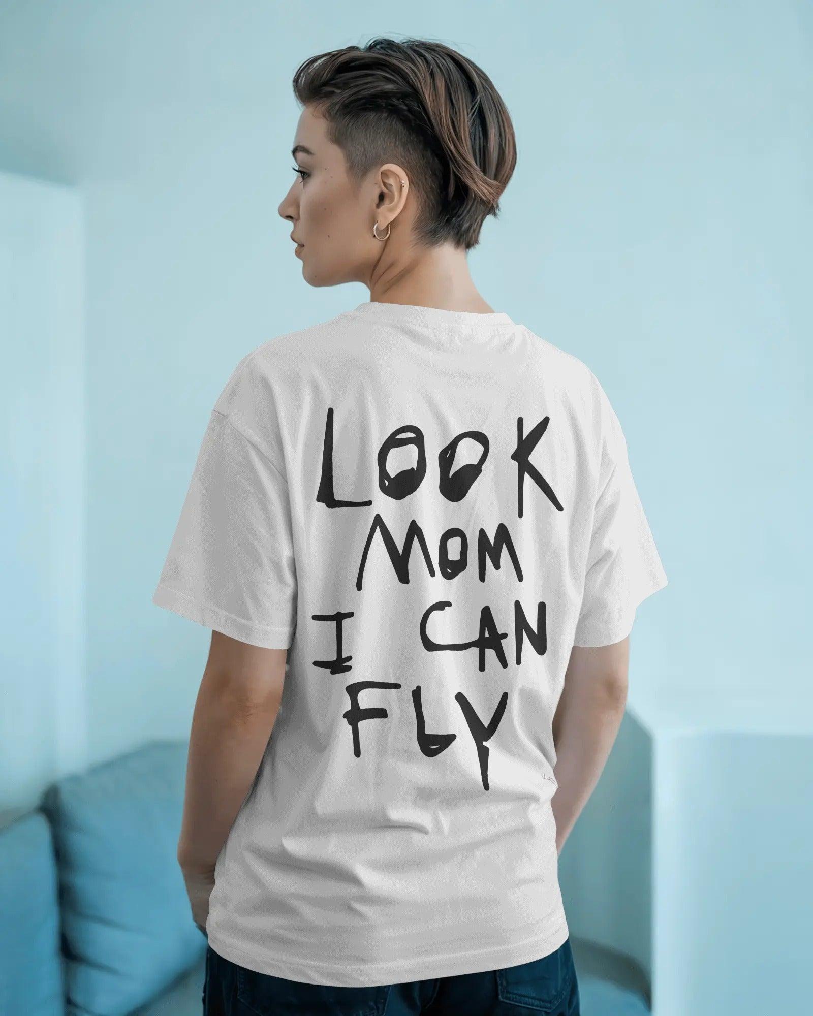 "White oversized t-shirt featuring 'Look Mom I Can Fly' Travis Scott-inspired print. Made from premium  cotton, designed for a bold streetwear look.