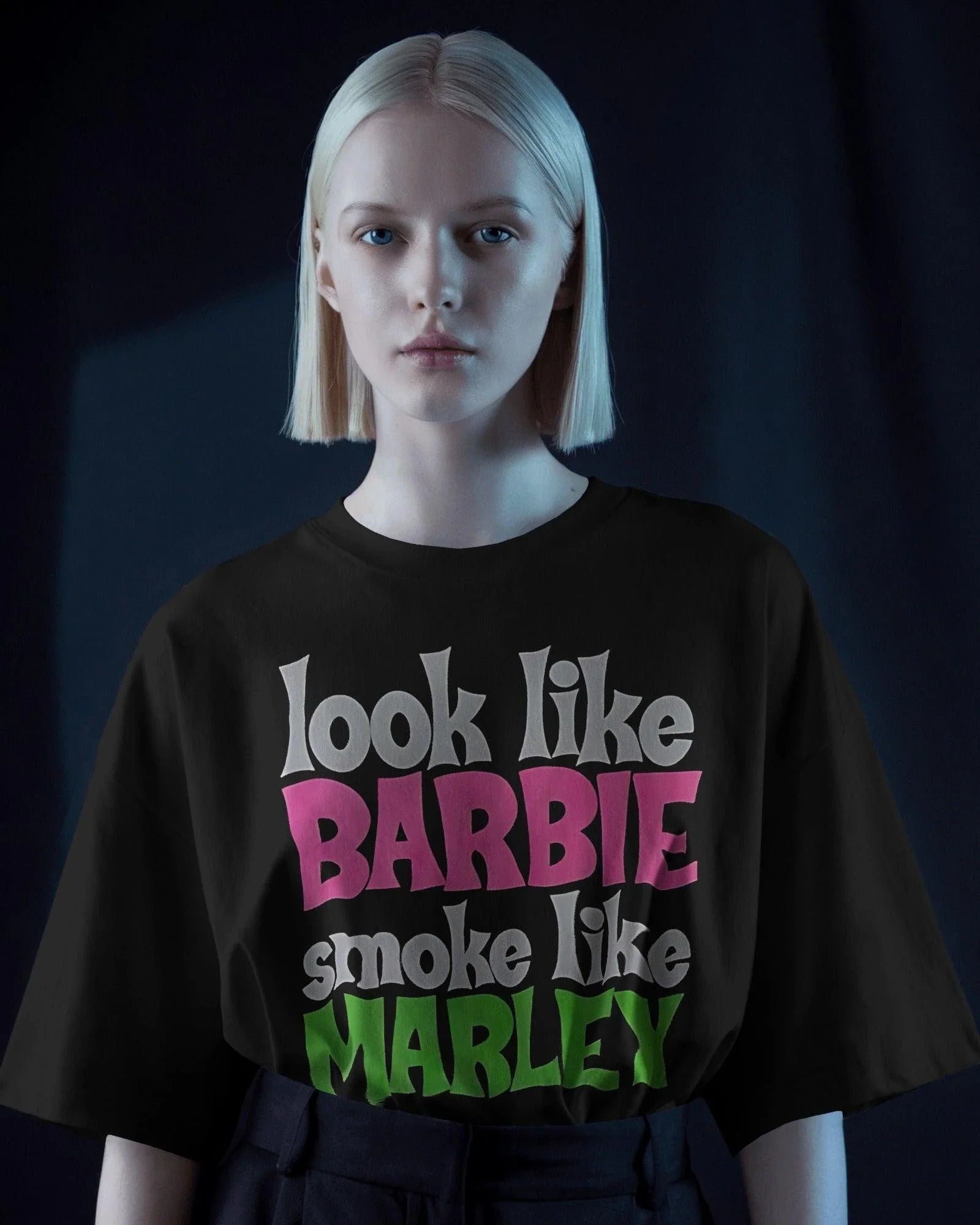 Black oversized t-shirt featuring a unique Barbie x Bob Marley graphic. This bold fusion of reggae vibes and pop culture creates a standout streetwear piece. Made from premium cotton for ultimate comfort and style.