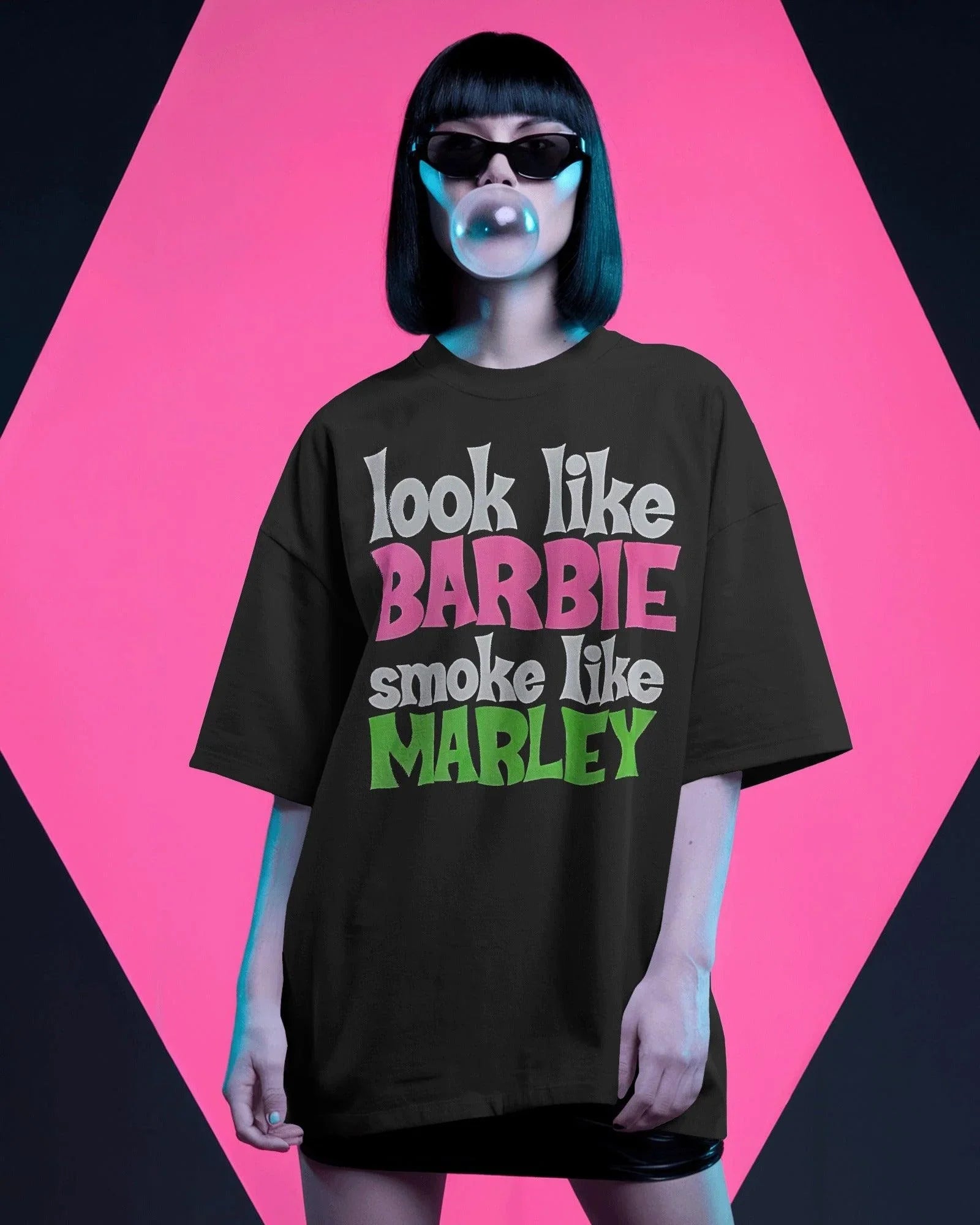 Black oversized t-shirt featuring a unique Barbie x Bob Marley graphic. This bold fusion of reggae vibes and pop culture creates a standout streetwear piece. Made from premium cotton for ultimate comfort and style.