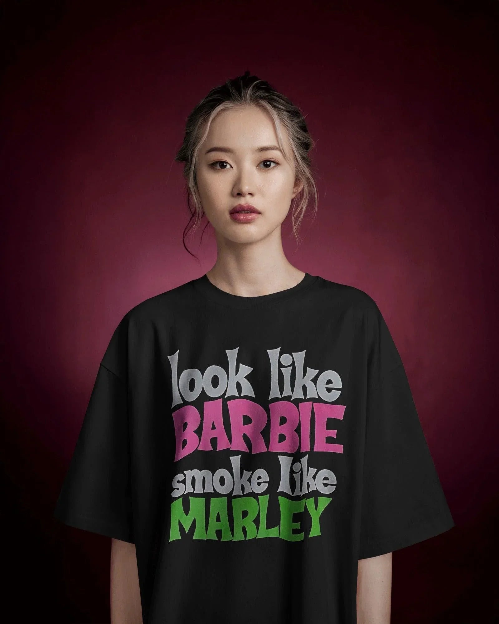 Black oversized t-shirt featuring a unique Barbie x Bob Marley graphic. This bold fusion of reggae vibes and pop culture creates a standout streetwear piece. Made from premium cotton for ultimate comfort and style.