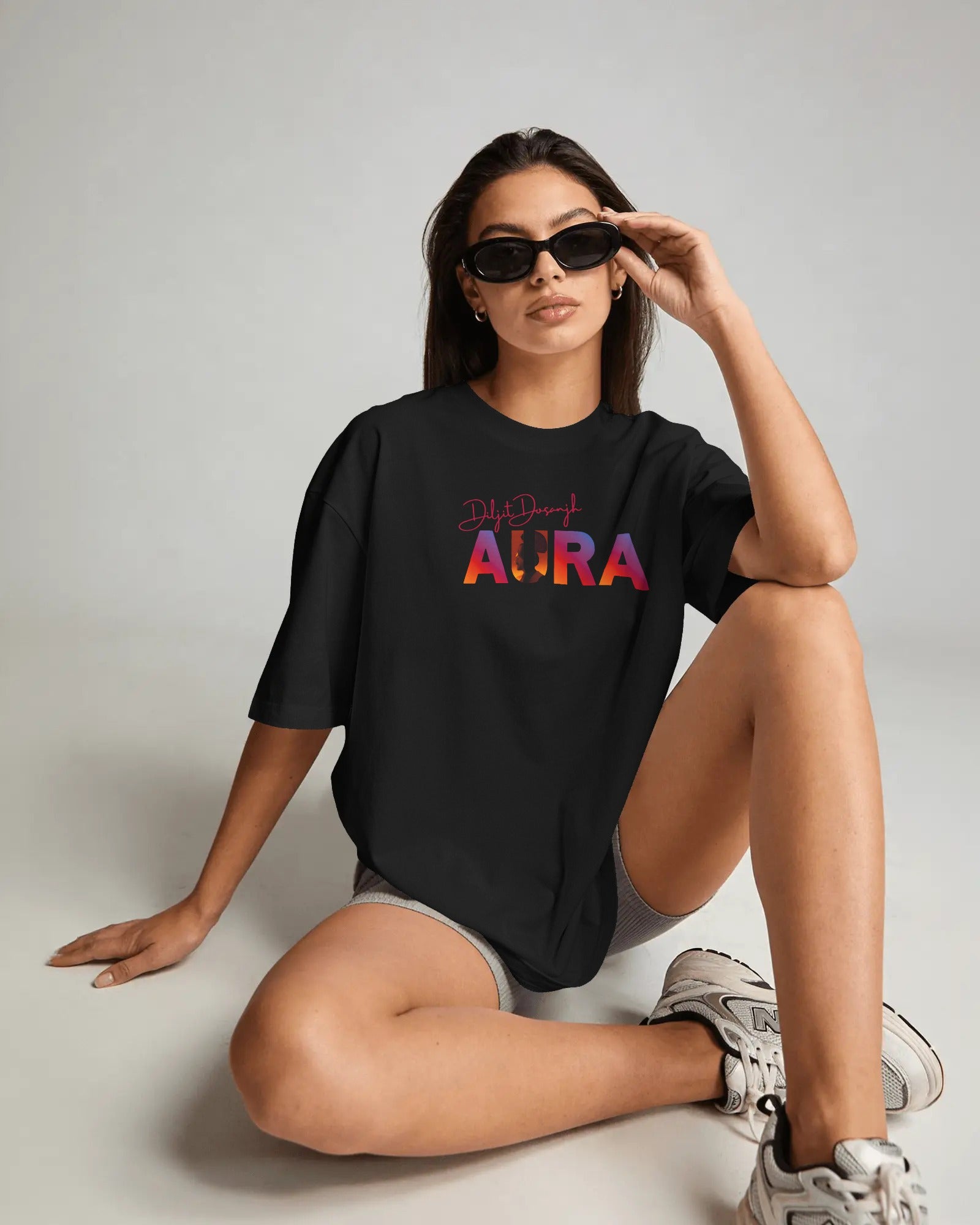 Close-up of Diljit Dosanjh Aura graphic print on oversized tshirt