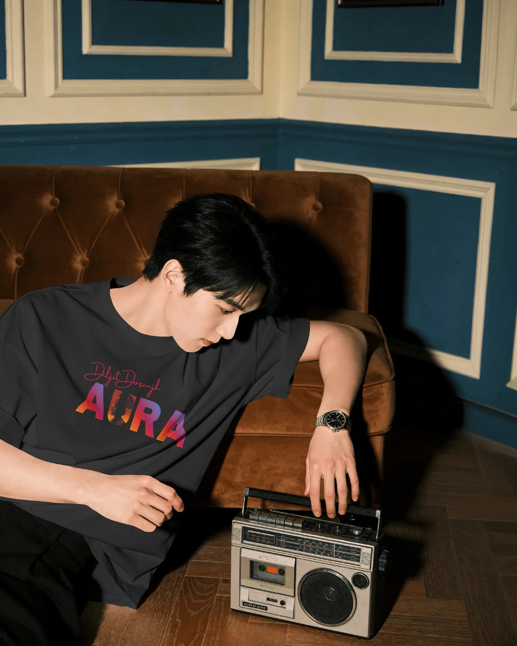 Model wearing Diljit Dosanjh Signature Edition Aura World Tour oversized tshirt