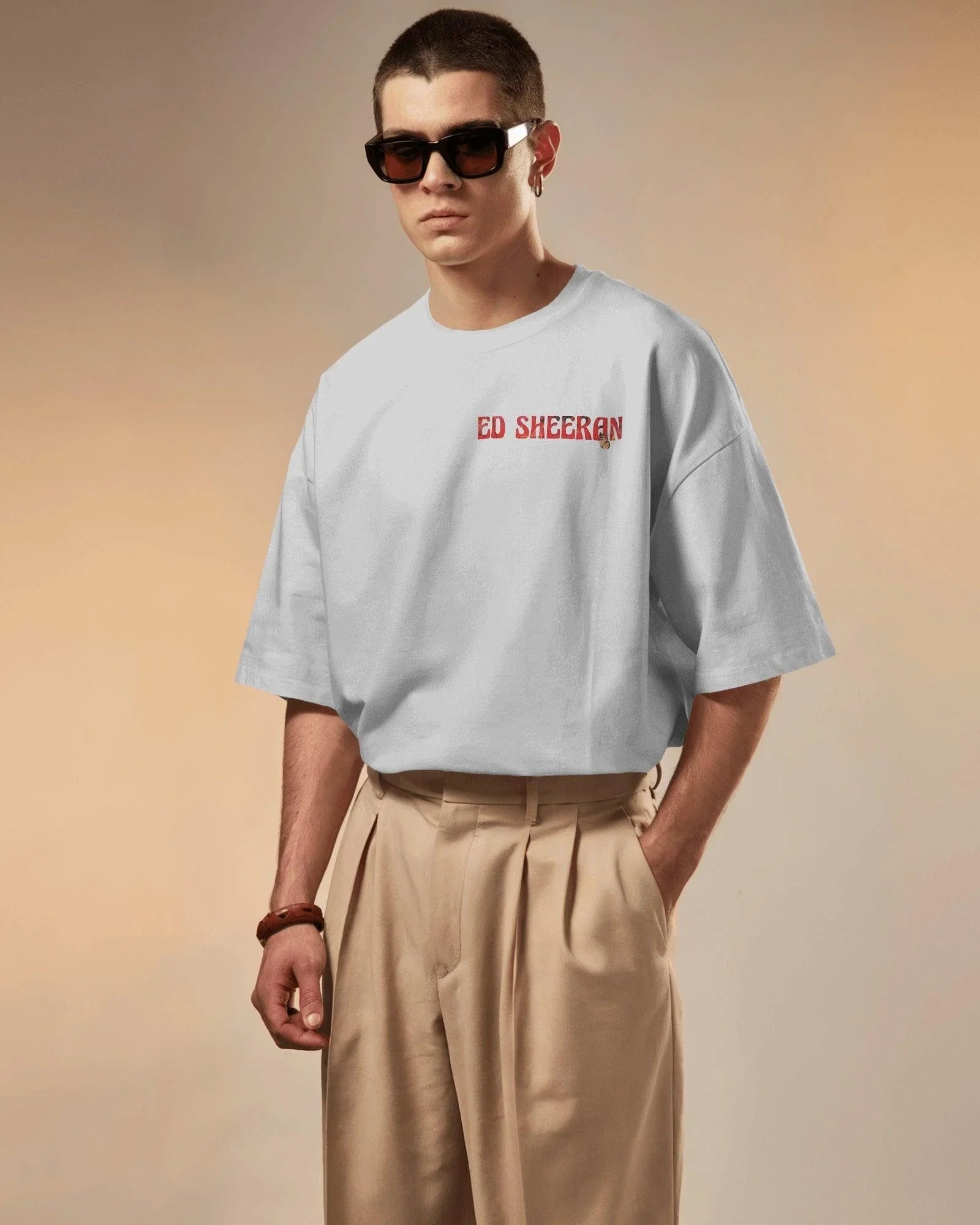 White oversized Ed Sheeran t-shirt from Nitorious Atelier featuring a striking red butterfly graphic alongside the iconic singer-songwriter. Crafted from premium cotton, this t-shirt offers a soft, breathable, and relaxed fit for all-day comfort and style.