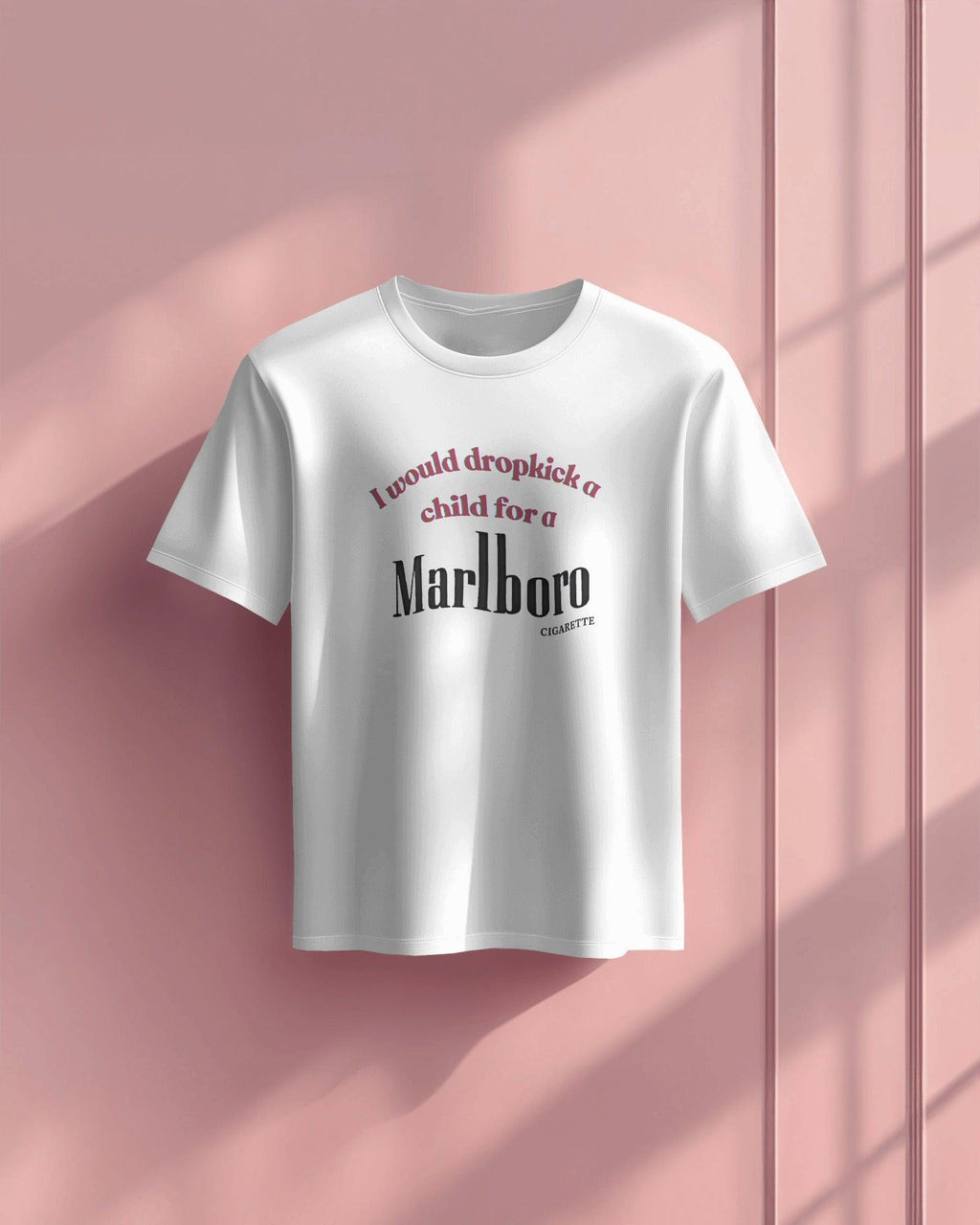 White oversized t-shirt featuring a bold, edgy text design. The statement 'I would dropkick a child for a Marlboro cigarette' is printed in a mix of red and black fonts, adding a rebellious streetwear vibe. Made from premium cotton, this t-shirt blends comfort with a striking, ironic aesthetic