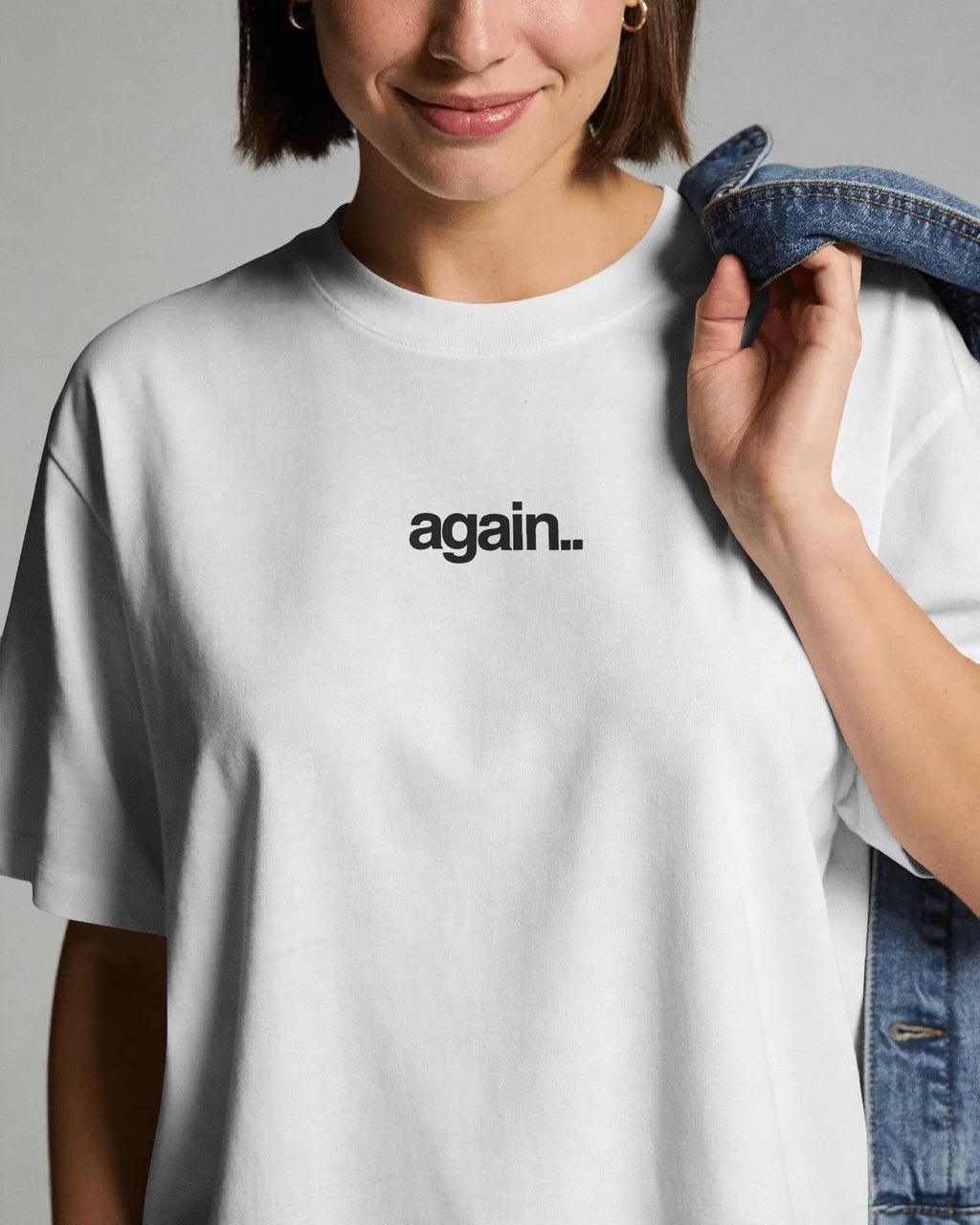 White oversized Fred Again concert t-shirt featuring again logo and back graphic