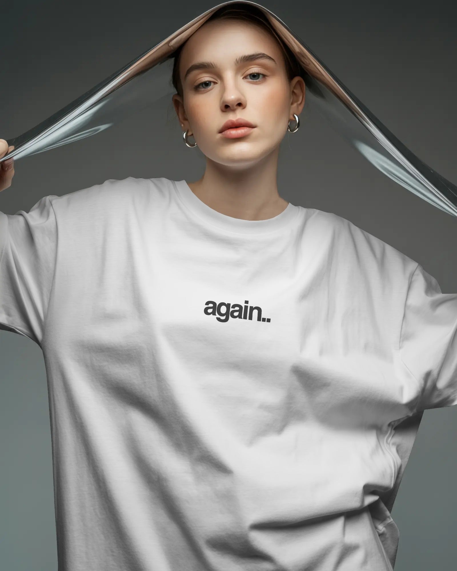 White oversized Fred Again concert t-shirt featuring again logo and back graphic from Nitorious Atelier