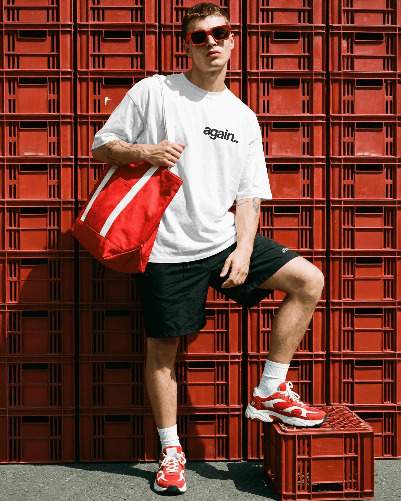 A man wearing a white t-shirt with 'again. Fred Again.. Tshirt India