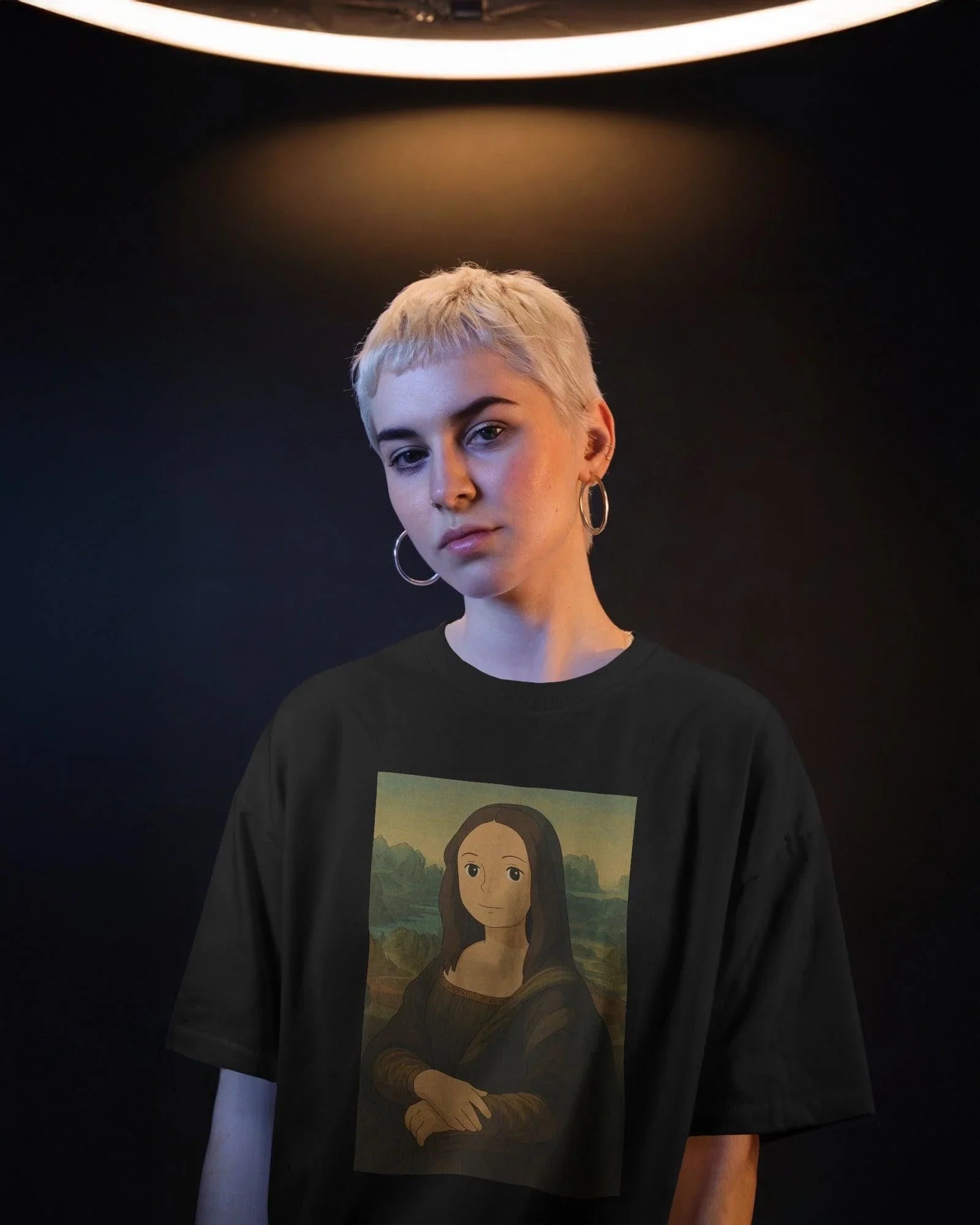 Black oversized t-shirt featuring a creative fusion of Ghibli art and the iconic Mona Lisa. The design reimagines the classic portrait in a whimsical anime-inspired style, printed on premium cotton for superior comfort and durability.