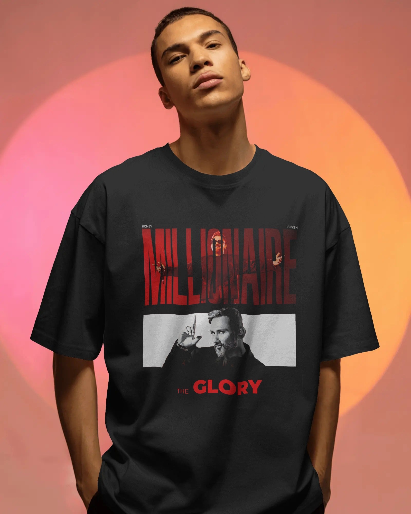 Person wearing a black t-shirt with graphic design and text against a gradient background