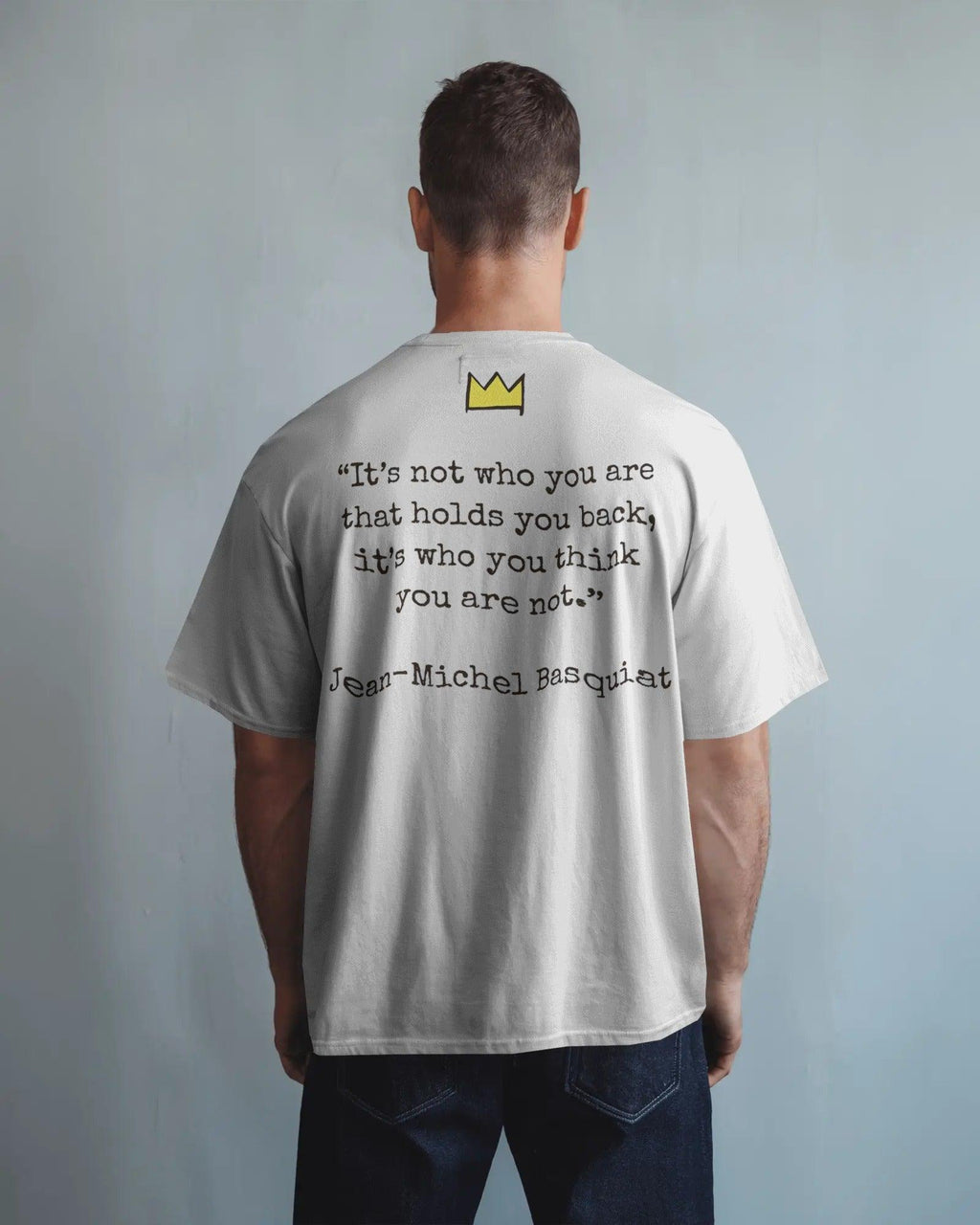 Black oversized t-shirt featuring a vibrant Jean-Michel Basquiat dinosaur artwork. Crafted from premium cotton, this t-shirt combines street art and fashion with a bold, expressive design.