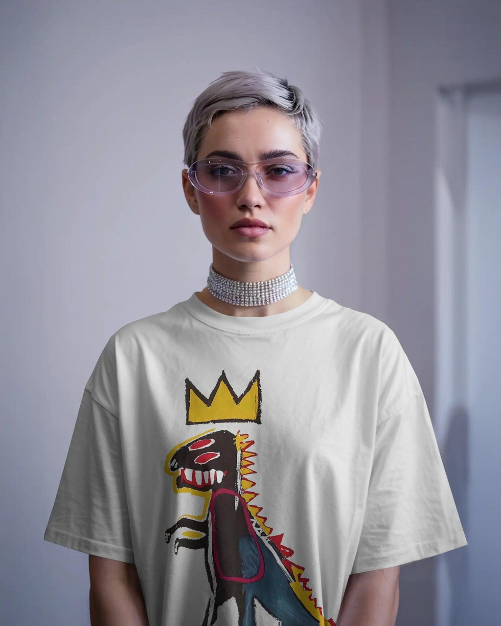 Black oversized t-shirt featuring a vibrant Jean-Michel Basquiat dinosaur artwork. Crafted from premium cotton, this t-shirt combines street art and fashion with a bold, expressive design.