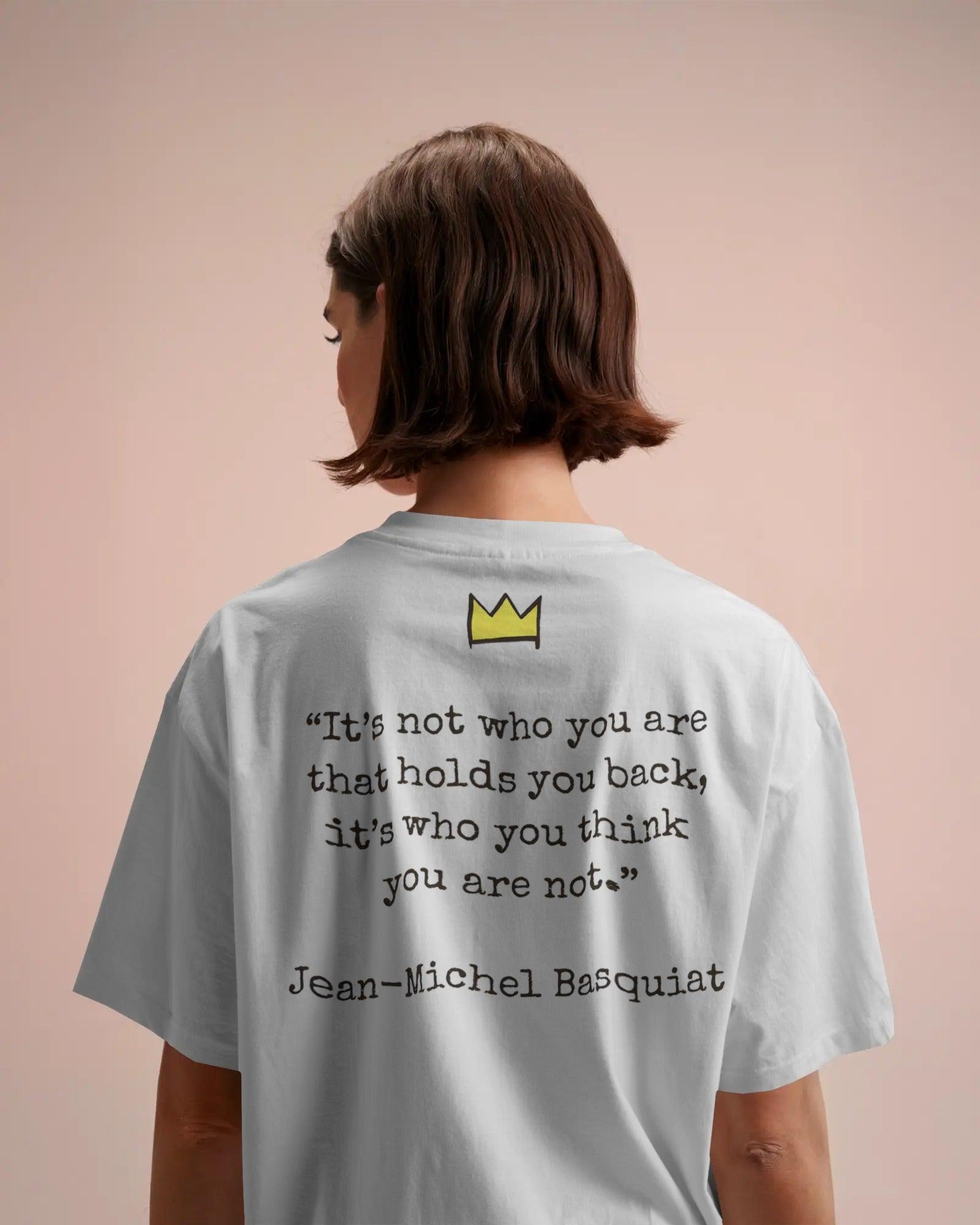 Black oversized t-shirt featuring a vibrant Jean-Michel Basquiat dinosaur artwork. Crafted from premium cotton, this t-shirt combines street art and fashion with a bold, expressive design.