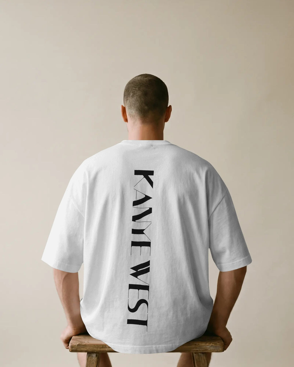 Oversized white t-shirt featuring Kanye West sky portrait and vertical back design