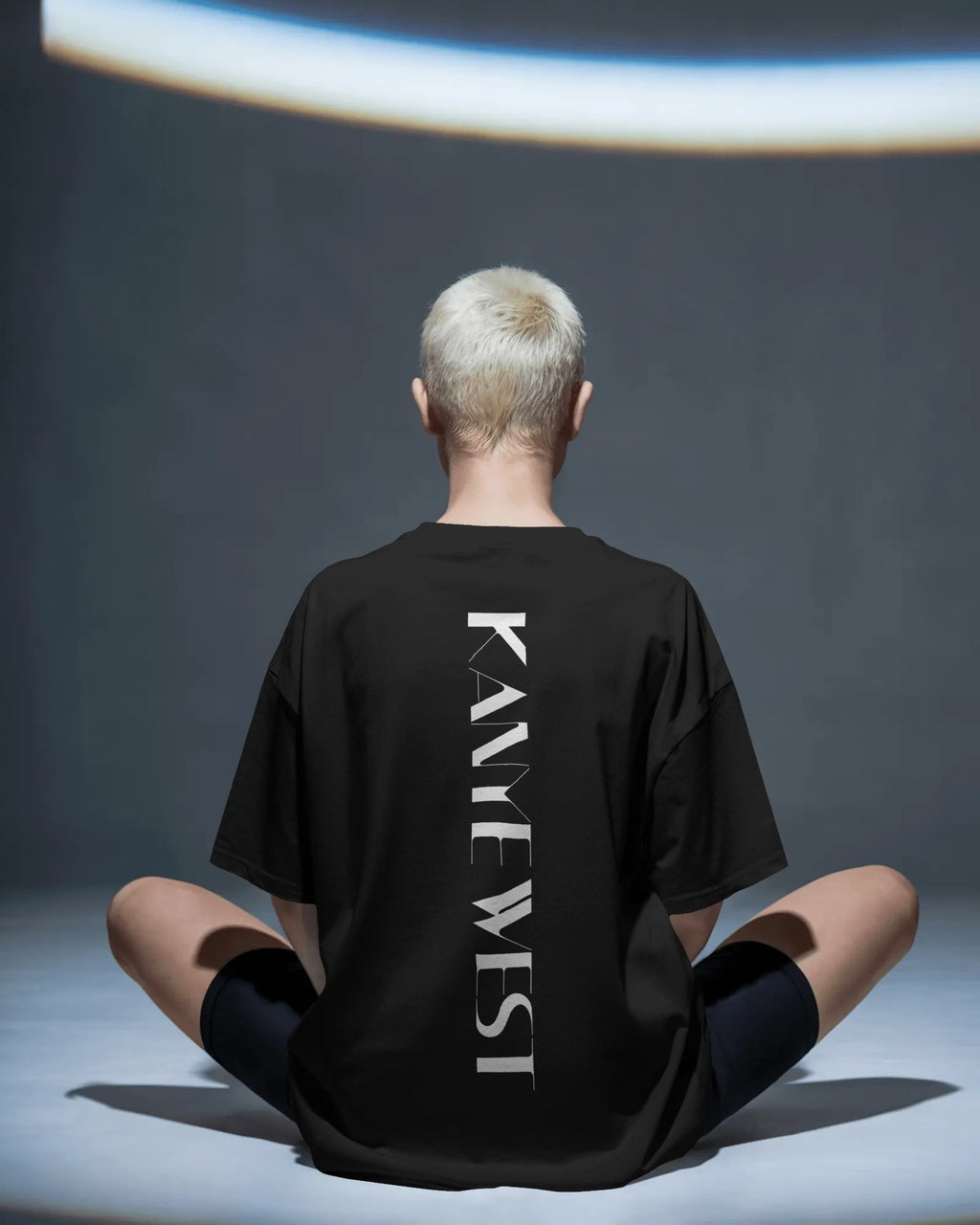 Kanye West YE inspired oversized black t-shirt from Nitorious Atelier with bold typography and portrait graphic in premium cotton