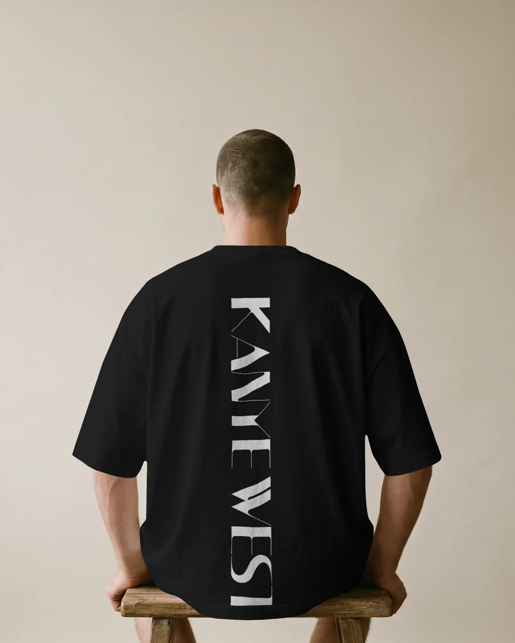 Kanye West YE inspired oversized black t-shirt from Nitorious Atelier with bold typography and portrait graphic in premium cotton