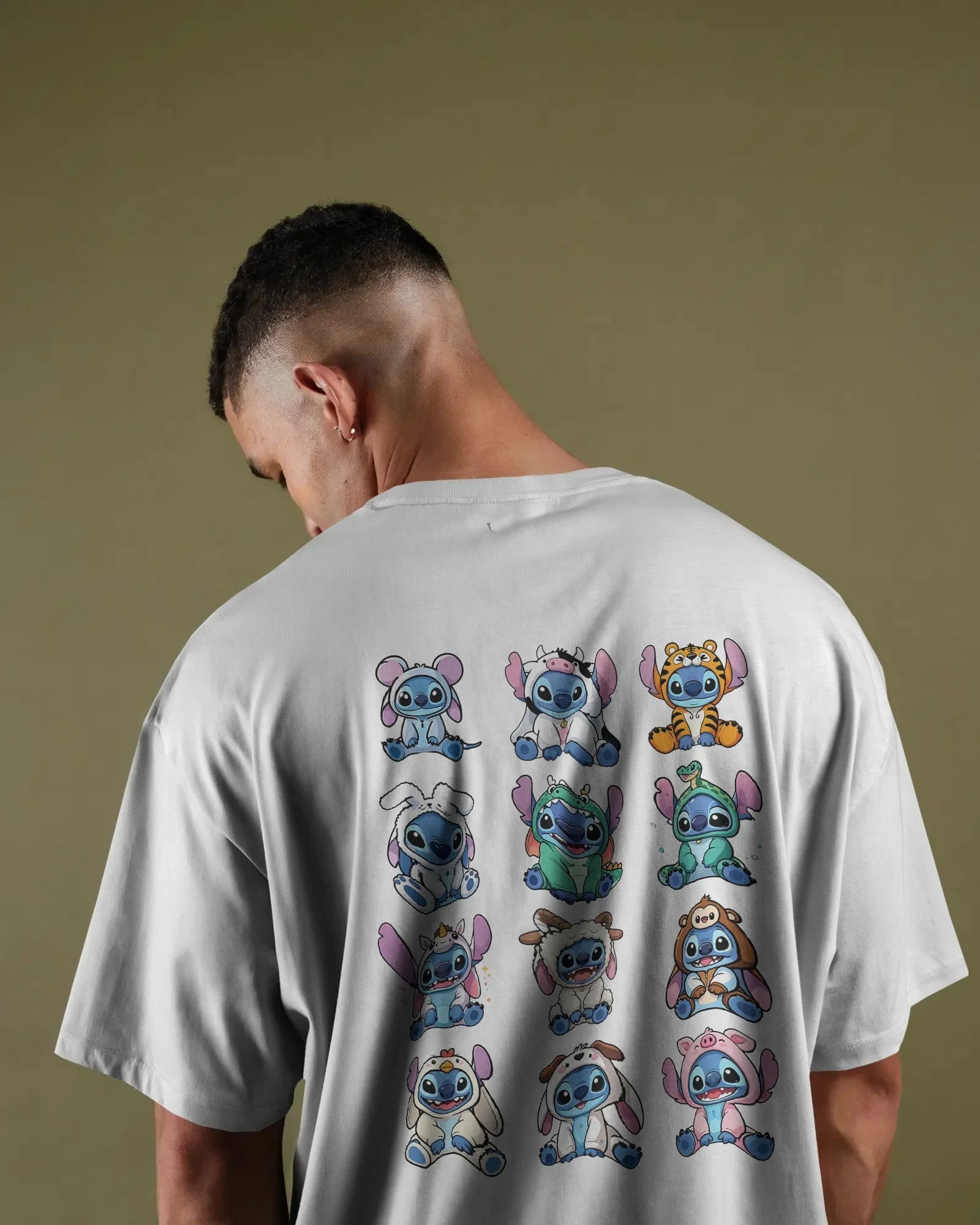 White oversized t-shirt from Nitorious Atelier featuring a striking ‘Lio and Stiches’ graphic print. Crafted from 220 GSM premium cotton for a soft, breathable, and durable streetwear look