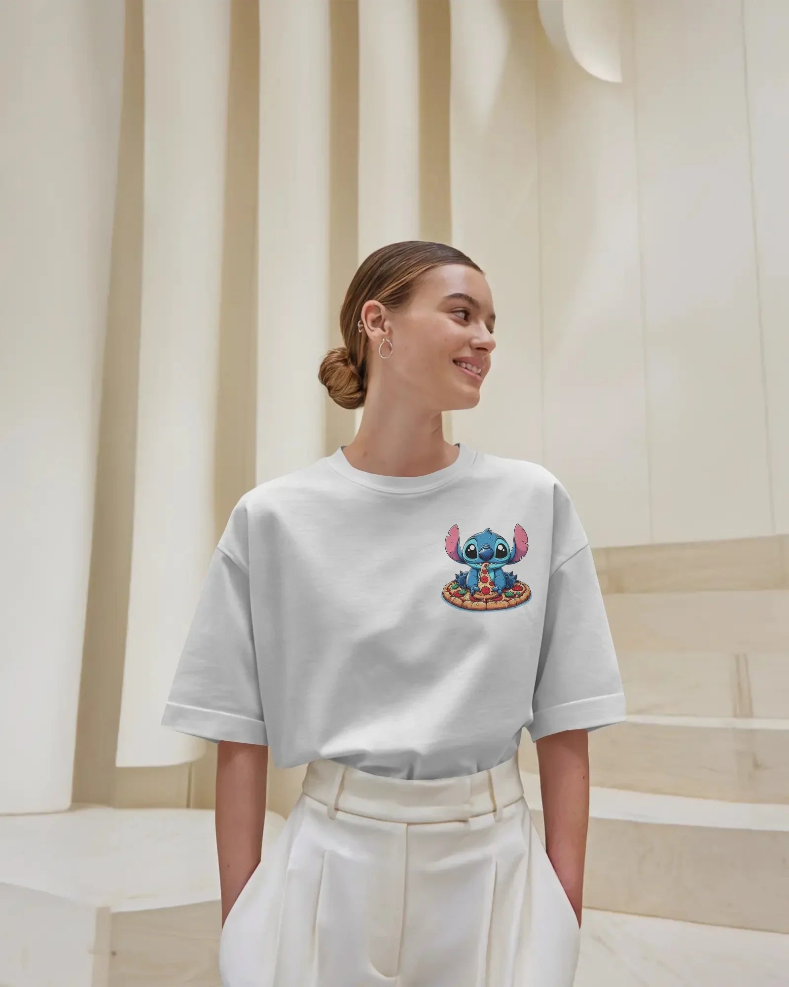 White oversized t-shirt from Nitorious Atelier featuring a striking ‘Lio and Stiches’ graphic print. Crafted from 220 GSM premium cotton for a soft, breathable, and durable streetwear look