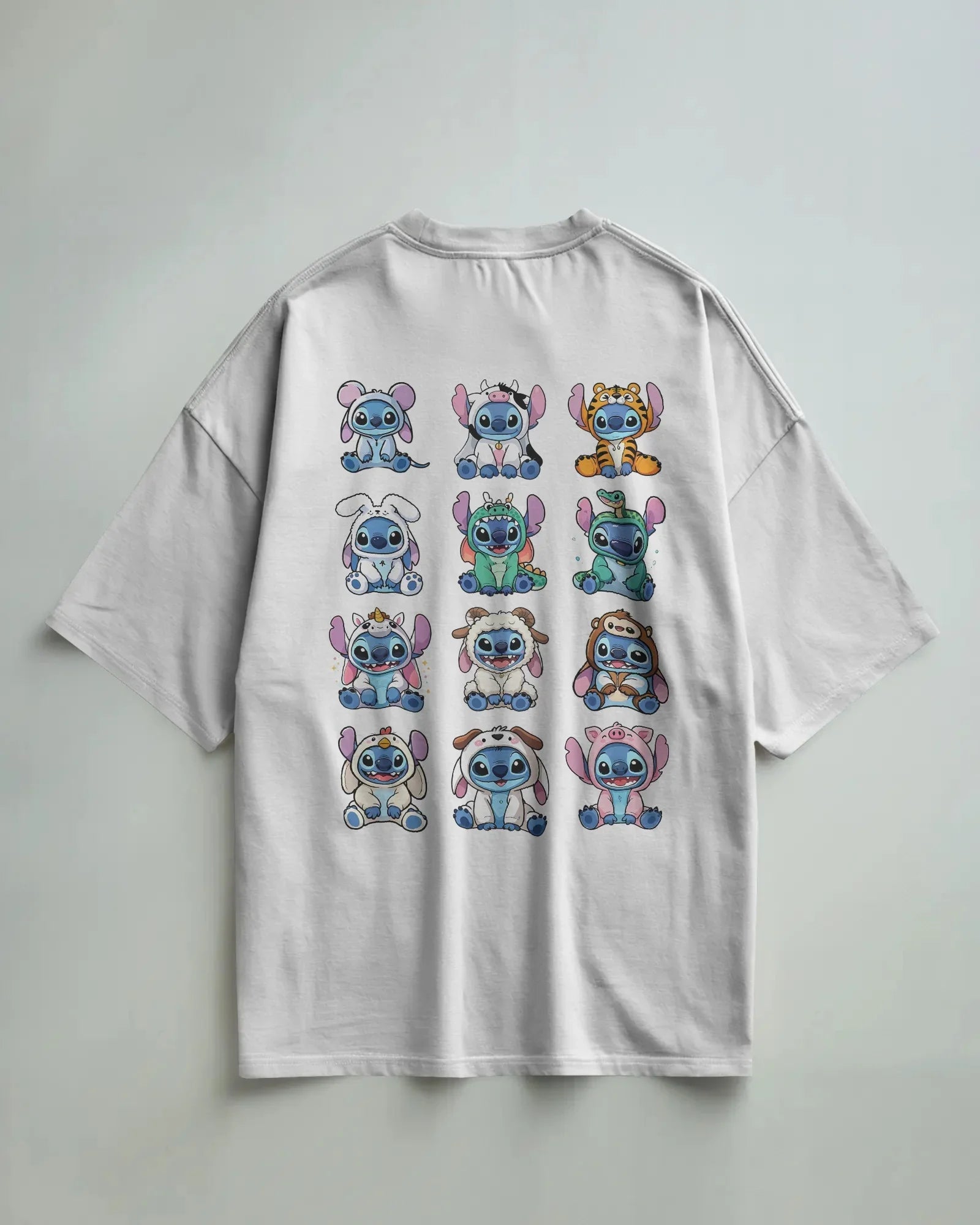 White oversized t-shirt from Nitorious Atelier featuring a striking ‘Lio and Stiches’ graphic print. Crafted from 220 GSM premium cotton for a soft, breathable, and durable streetwear look