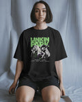 Linkin Park Neon Duo Oversized Black T-Shirt with neon green logo and duo portrait graphic worn by male model.