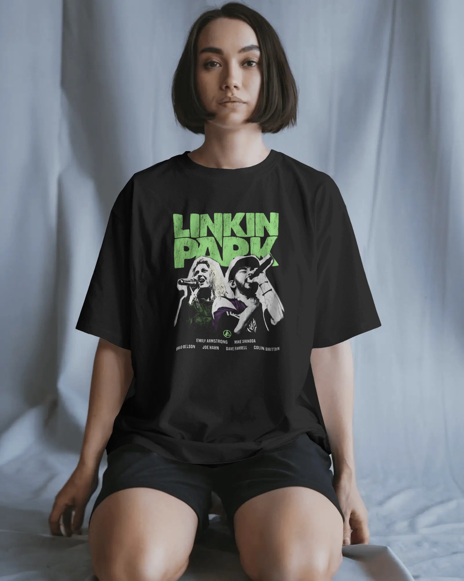 Linkin Park Neon Duo Oversized Black T-Shirt with neon green logo and duo portrait graphic worn by male model.