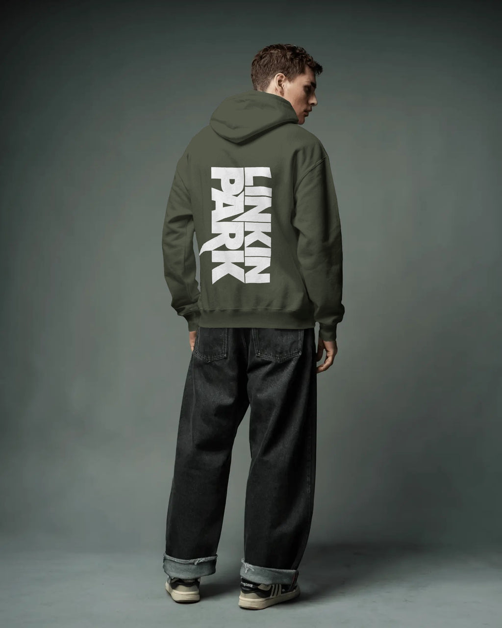 Close-up of Linkin Park crest graphic on olive hoodie