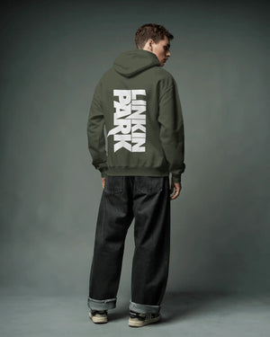 Close-up of Linkin Park crest graphic on olive hoodie