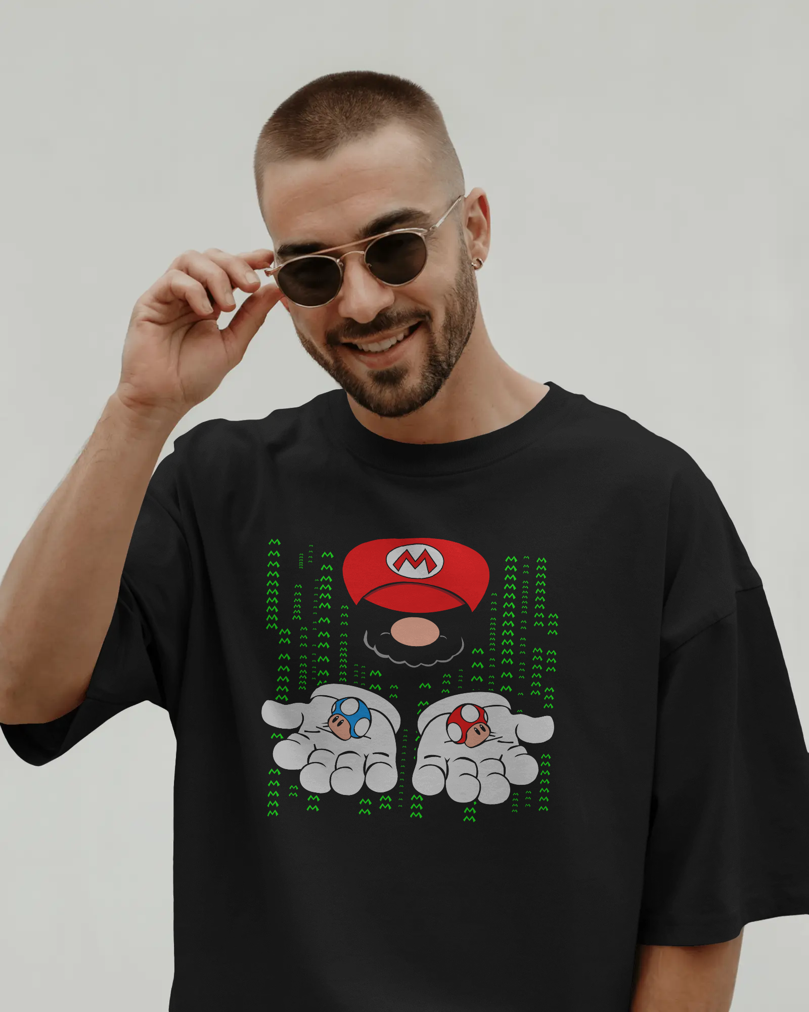 Black oversized t-shirt featuring a bold Mario print. Made from premium cotton, this t-shirt offers a relaxed fit, soft feel, and vibrant graphic for fans of classic gaming