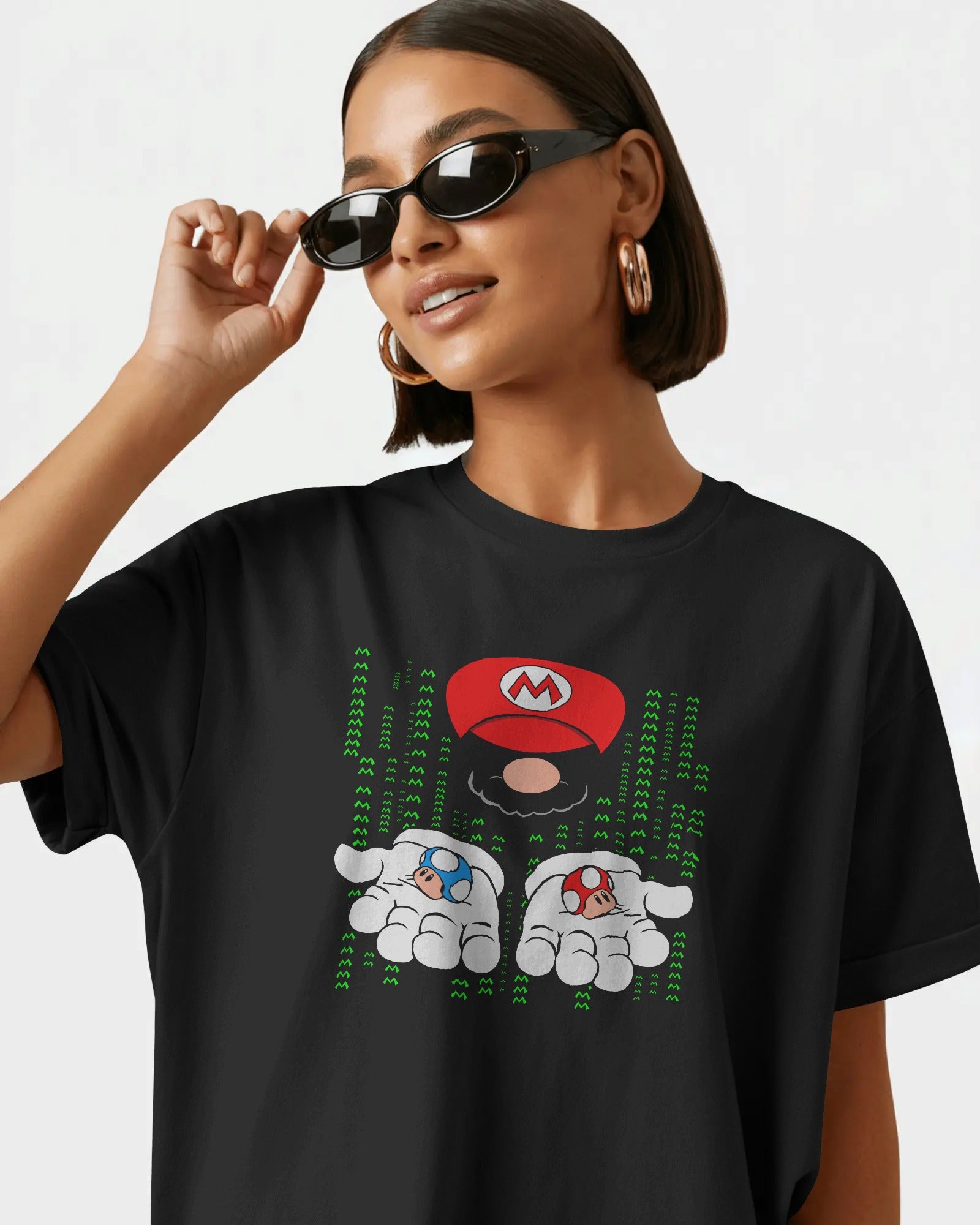 Black oversized t-shirt featuring a bold Mario print. Made from premium cotton, this t-shirt offers a relaxed fit, soft feel, and vibrant graphic for fans of classic gaming