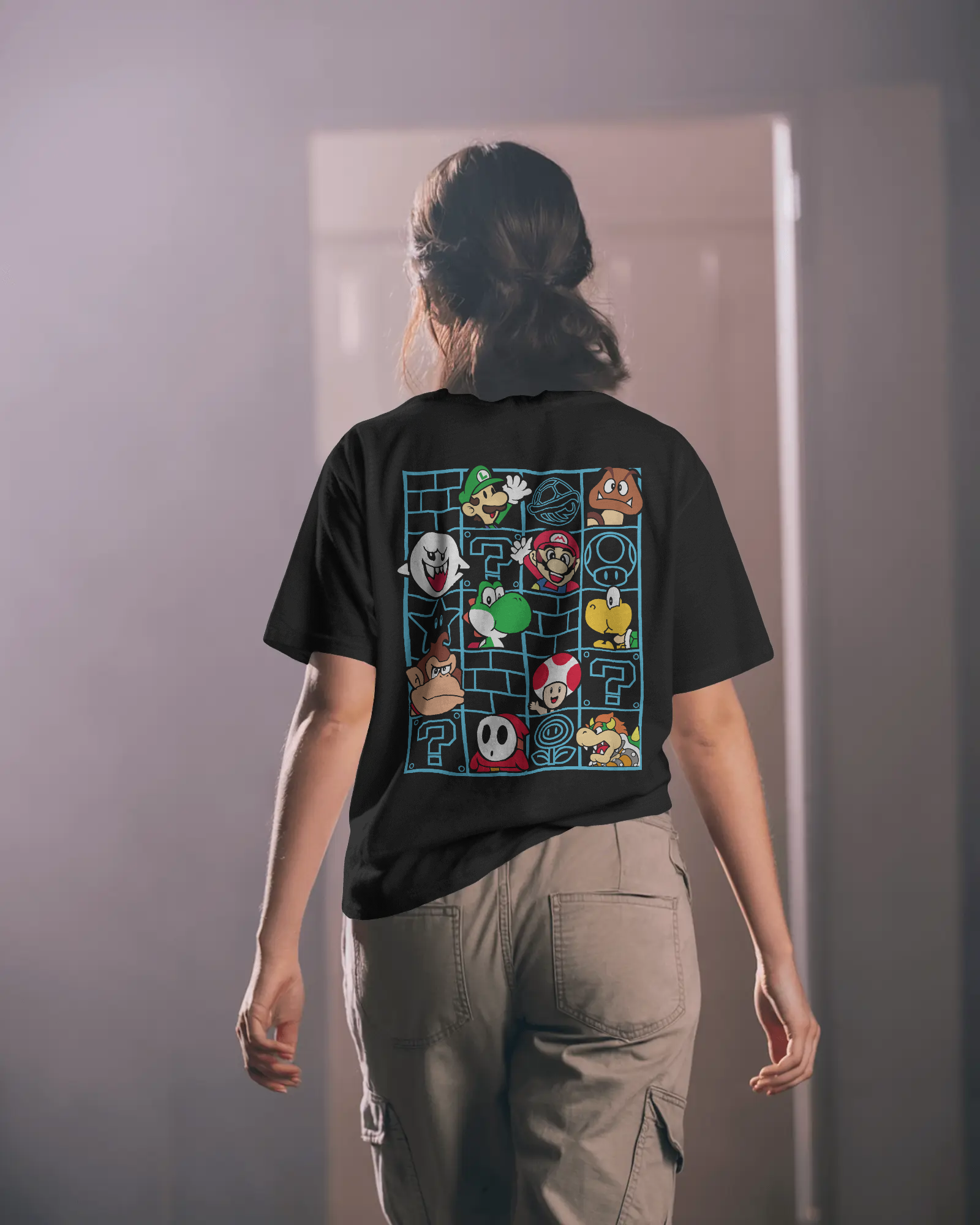 Black oversized t-shirt featuring a bold Mario print. Made from premium cotton, this t-shirt offers a relaxed fit, soft feel, and vibrant graphic for fans of classic gaming