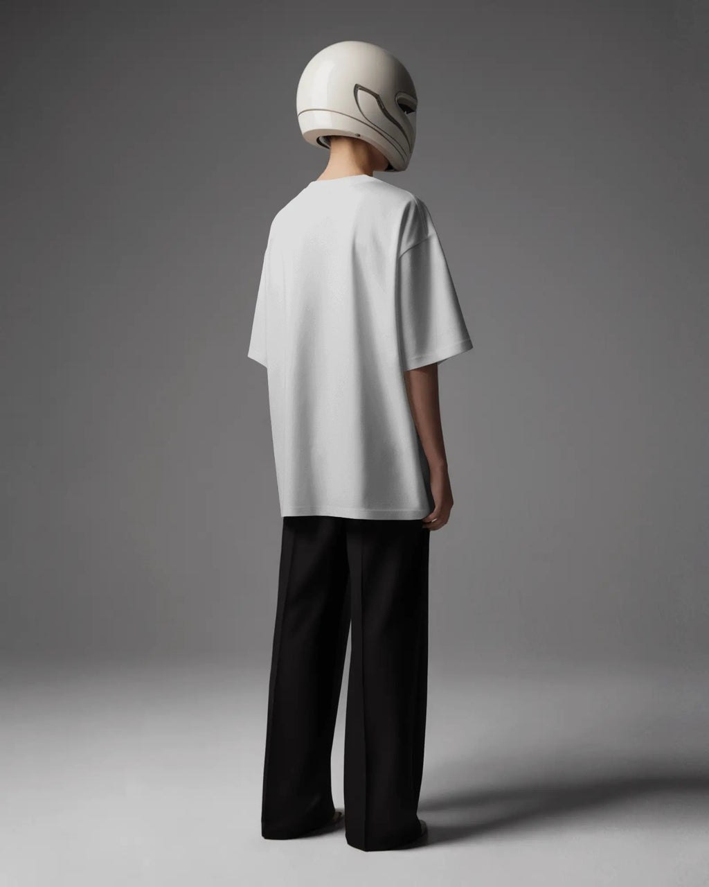 Person wearing a white Nitorious Atelier AP Dhillon concert t-shirt with 'OKAY STFU' text against a light background