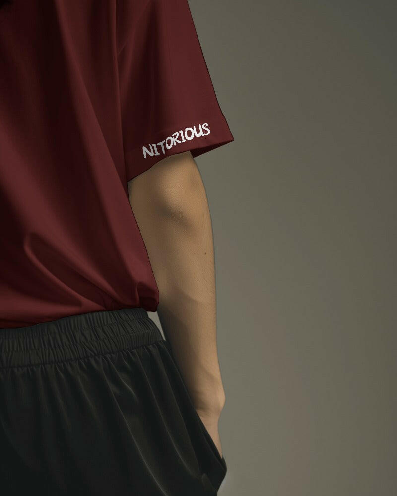 Nitorious Atelier's regular fit Maroon tee, featuring Adventure print, combines comfort and style effortlessly