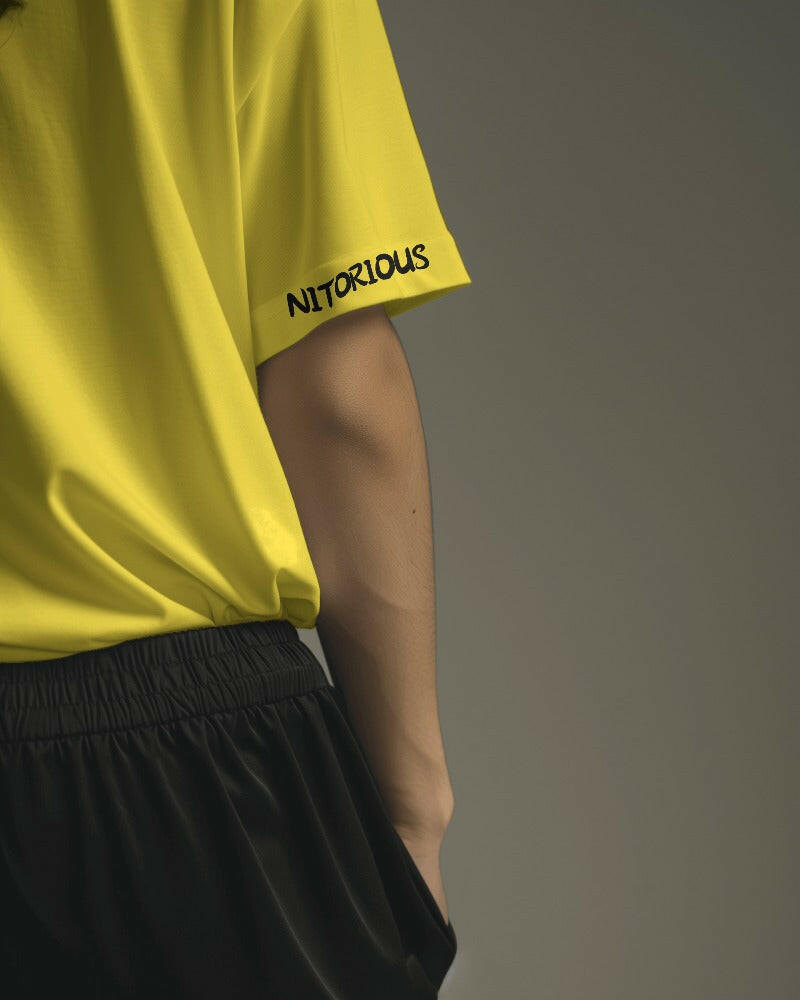 Nitorious Atelier's regular fit Yellow tee, featuring Adventure print, combines comfort and style effortlessly