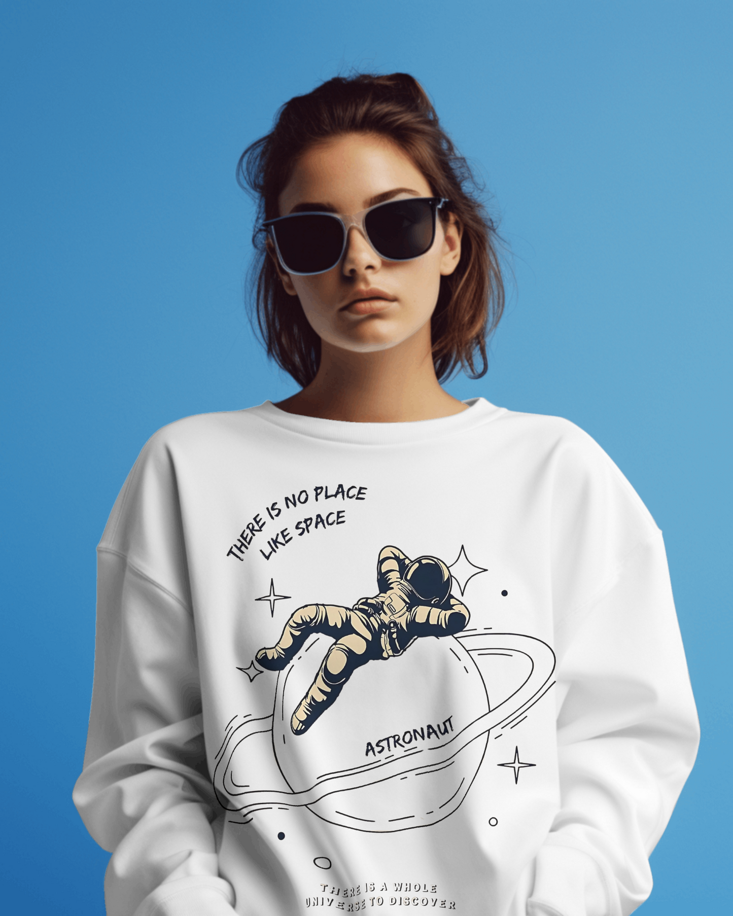 White sweatshirt featuring a bold astronaut graphic, crafted from soft, premium cotton fleece for comfort and warmth. This Nitorious Atelier sweatshirt has a relaxed fit with ribbed cuffs and hem, perfect for a stylish, space-inspired look.