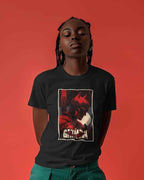 Person wearing a black t-shirt with a graphic design on a red background