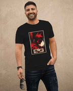 Man wearing a black t-shirt with a graphic design of a Batman The Dark Knight, standing against a beige wall.