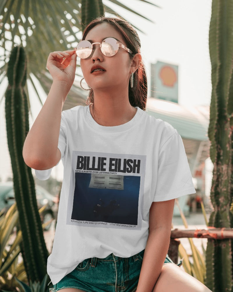 White regular fit Billie Eilish t-shirt from Nitorious Atelier featuring a bold, colorful graphic of Billie Eilish. Made from premium cotton, this t-shirt offers exceptional comfort and style. Perfect for fans and fashion enthusiasts looking to make a statement with a high-quality, trendy piece.