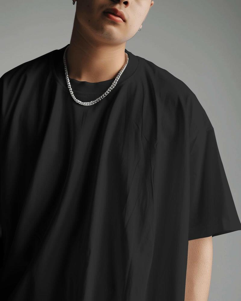 An oversized, solid basic Black tee from Nitorious Atelier, offering comfort and style in equal measure.