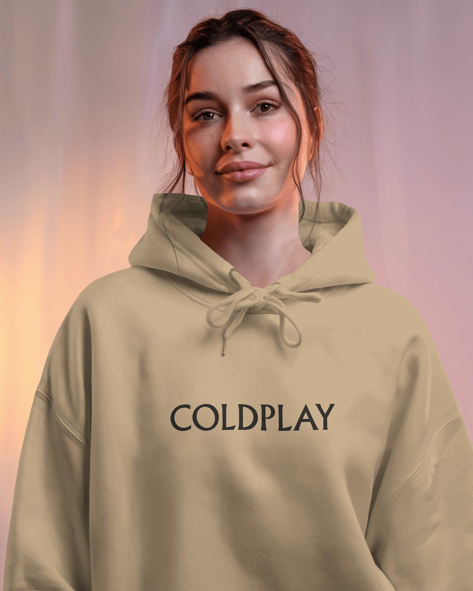 Beige hoodie from Nitorious Atelier featuring a Coldplay-inspired design. Made with 100% premium cotton fleece, this hoodie offers unmatched comfort, warmth, and style for music lovers.