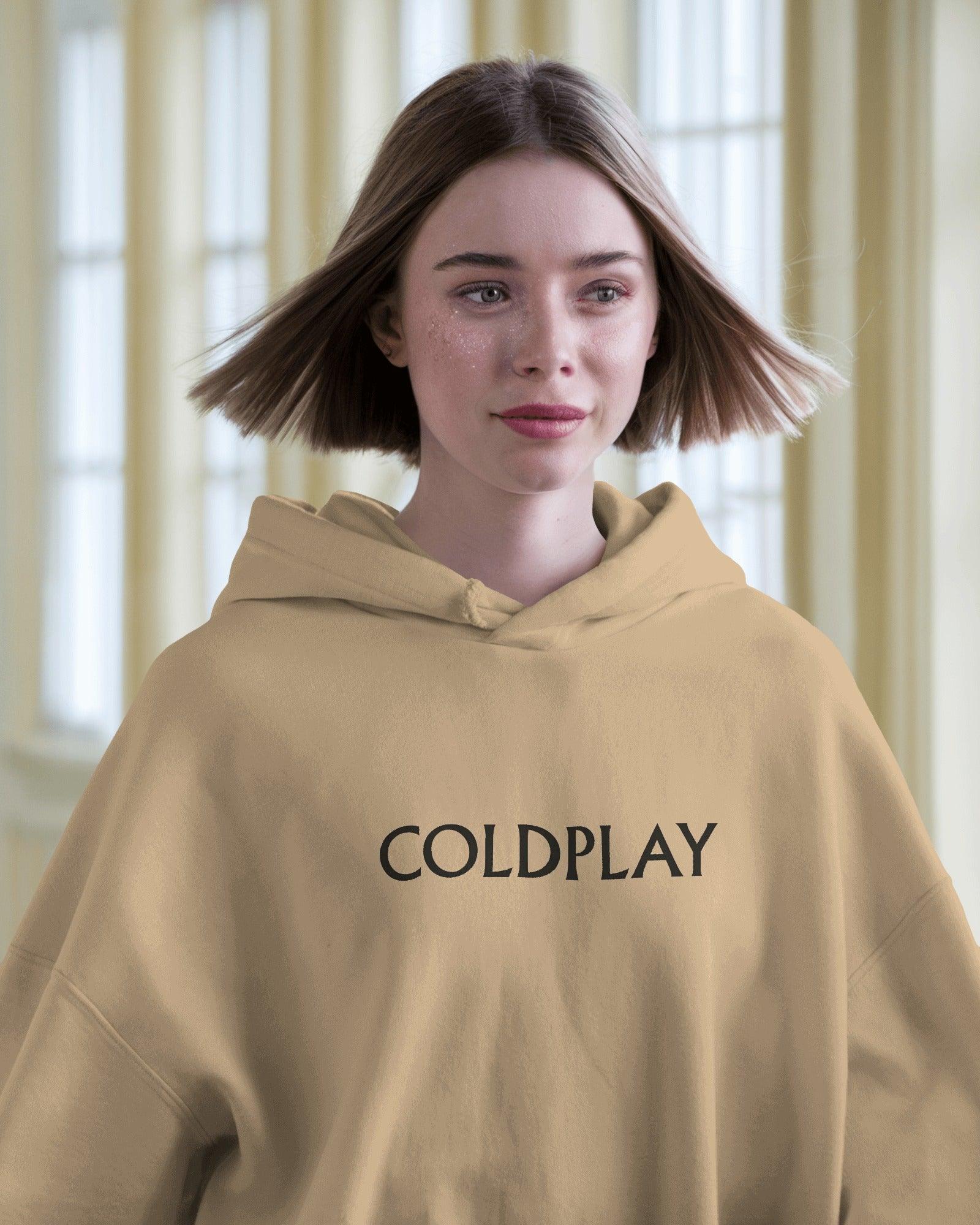 Beige hoodie from Nitorious Atelier featuring a Coldplay-inspired design. Made with 100% premium cotton fleece, this hoodie offers unmatched comfort, warmth, and style for music lovers.