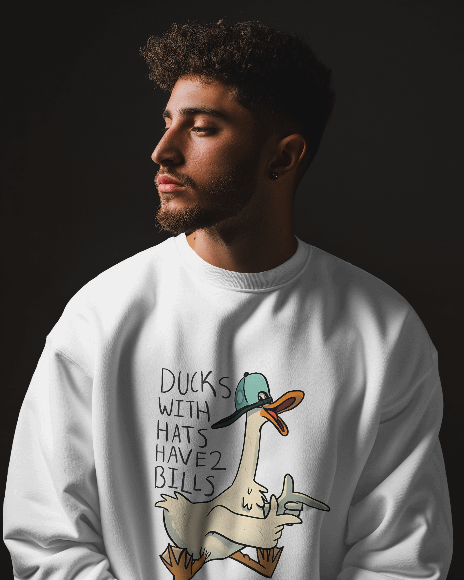 White sweatshirt from Nitorious Atelier featuring a charming duck print on the chest. Made from premium cotton fleece, this sweatshirt offers a cosy and stylish fit for casual wear.