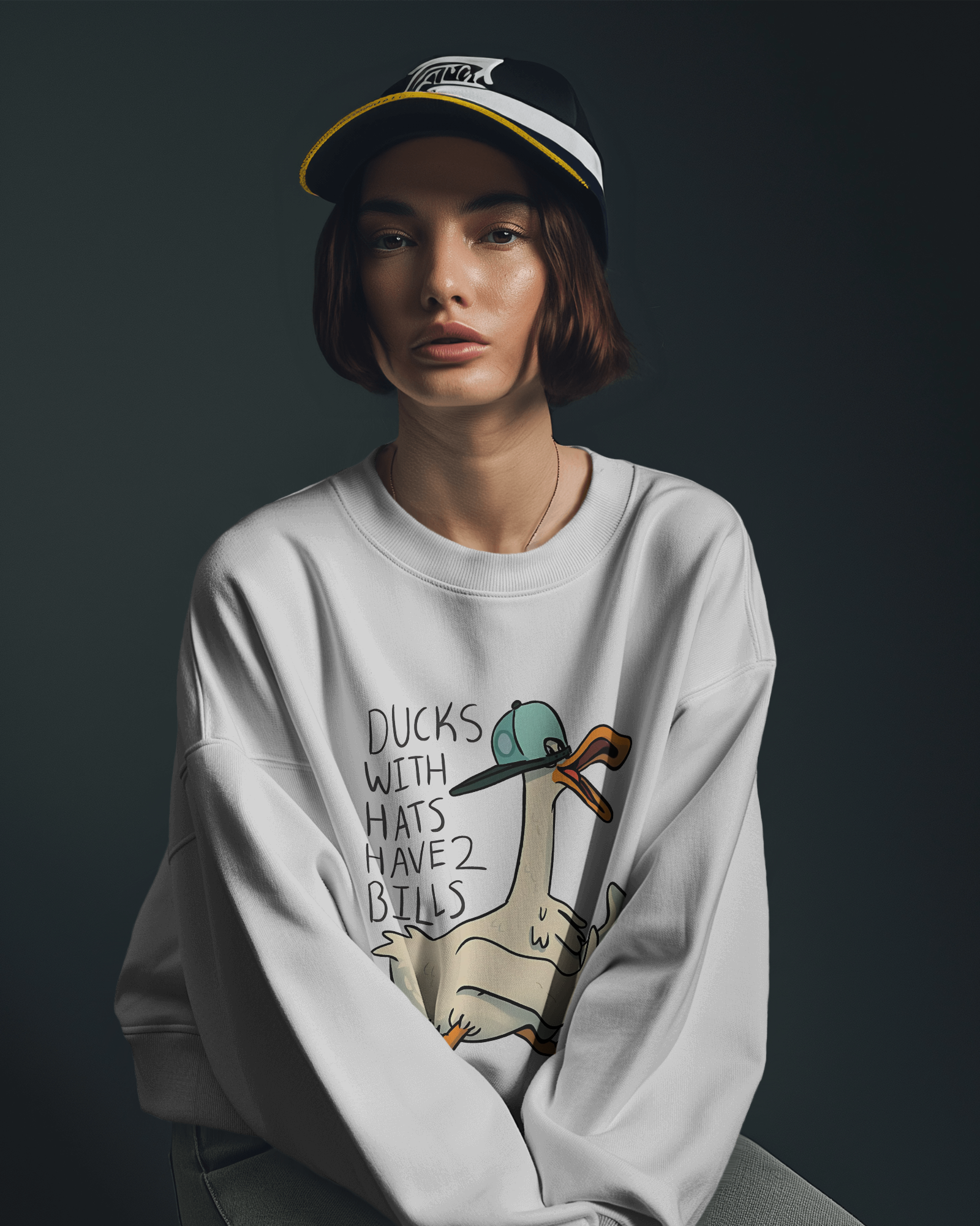 White sweatshirt from Nitorious Atelier featuring a charming duck print on the chest. Made from premium cotton fleece, this sweatshirt offers a cosy and stylish fit for casual wear.