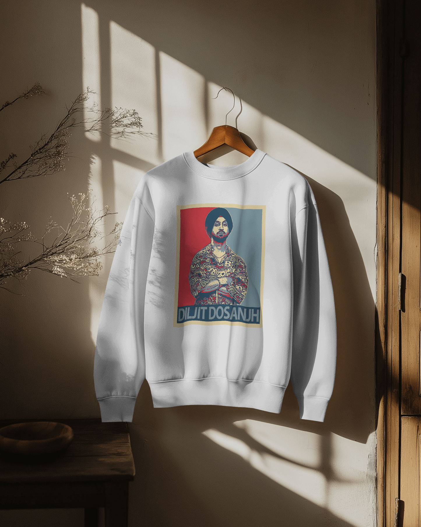 Diljit Dosanjh G.O.A.T white sweatshirt featuring a bold graphic inspired by his iconic album. Made from high-quality cotton fleece, this sweatshirt offers warmth and comfort, perfect for fans looking to showcase their love for the artist in style during colder weather