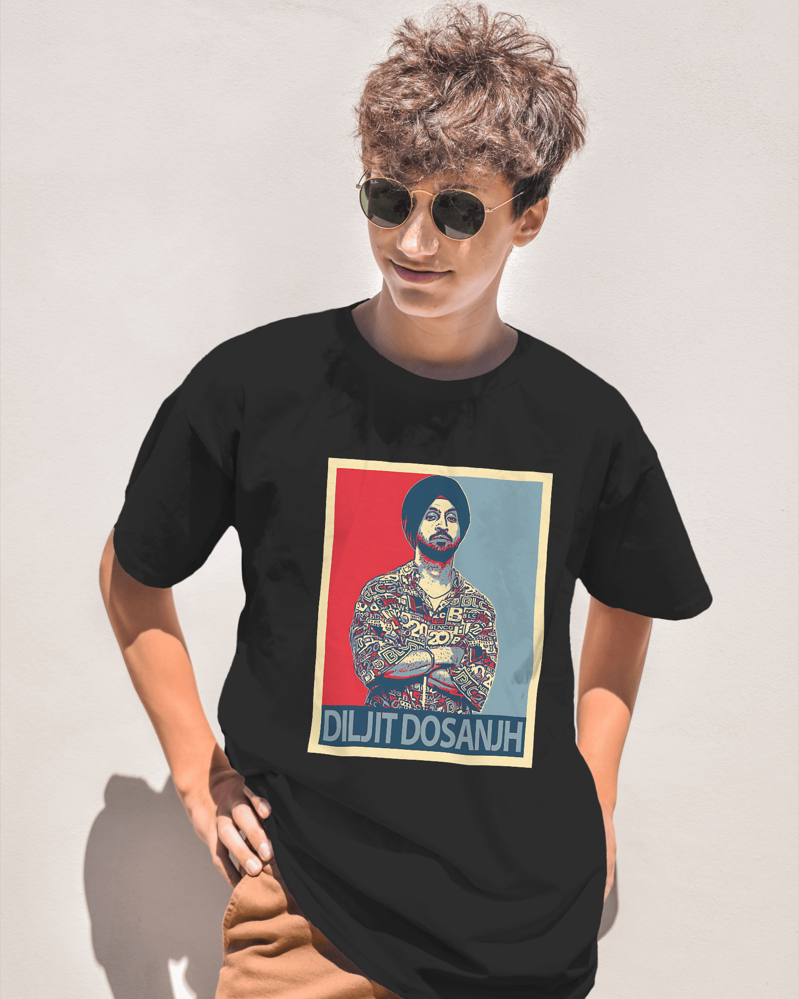 Diljit Dosanjh black t-shirt featuring a vibrant graphic of the Punjabi superstar. Made from premium cotton, this t-shirt offers a comfortable fit and is perfect for fans who want to showcase their love for the iconic artist.